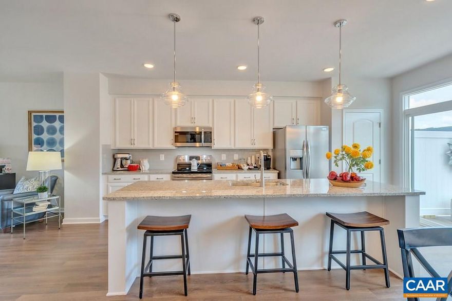 Located just minutes from the Downtown Mall, this home offers beautiful, designer inspired finishes. The effortlessly open floorplan has a spacious galley kitchen which leads to an outdoor deck that is perfect for an evening of entertaining friends and family. Soak up the Carter?s Mountain views from the optional rooftop terrace or while playing with your dog in the neighborhood dog park. Enjoy a weekend complete with a dinner and a movie at 5th St. Station, conveniently only a mile away! Summer/Fall 2019 Completion. Similar photos.,Granite Counter,Maple Cabinets