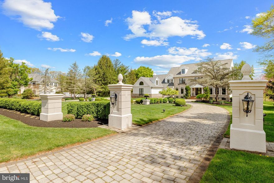 A remarkable find in one of the most exclusive and sought-after neighborhoods in Upper Makefield Township, welcome to the comfortable yet luxurious 24 Weatherfield Drive. An elegant estate nestled on a 2+ acre parcel within the confines of a custom neighborhood setting allows for the best of both worlds: privacy and community. Quality and superior craftsmanship exudes both inside and out beginning with the elegant stone and Hardie plank exterior embellished with black framed windows and glass doors that bring the outdoors in and a stunning paver parking court to greet guests. This stately home offers 4 finished levels of flexible, family friendly spaces. Everything about this property is masterfully planned with ultimate comfort and gorgeous aesthetics in mind. Some of the home’s noteworthy features include a designer kitchen with breakfast area equipped with quartz countertops, separate coffee bar, expansive island, state-of-the-art stainless-steel appliances and the neighboring Butler Area with built-in icemaker and access to the large walk-in pantry. Beyond, the dramatic 2-story family room with floor-to-ceiling stone fireplace and hardwood floors showcases an open back staircase. Access to the covered outdoor porch provides delightful views of the yard, pool & spa. A walk-out lower level with multiple rooms including a living room with stone fireplace, the ultimate sports bar, wine cellar, gym and full bath with shower and sauna, all with direct access to outdoor patios, pool, and gardens. Other notable amenities include an updated and reconfigured bath to include an eye-catching wet room, au-pair suite, new HVAC, and a newer roof.  This magnificent estate offers exceptional value and an opportunity to live and host in the most idyllic setting within close proximity to I-295, Princeton, New York City, and Philadelphia.