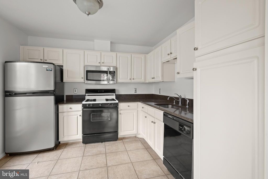 Photo of 5951 Millrace Court #C-104, COLUMBIA, MD 21045 (MLS # MDHW2060202)