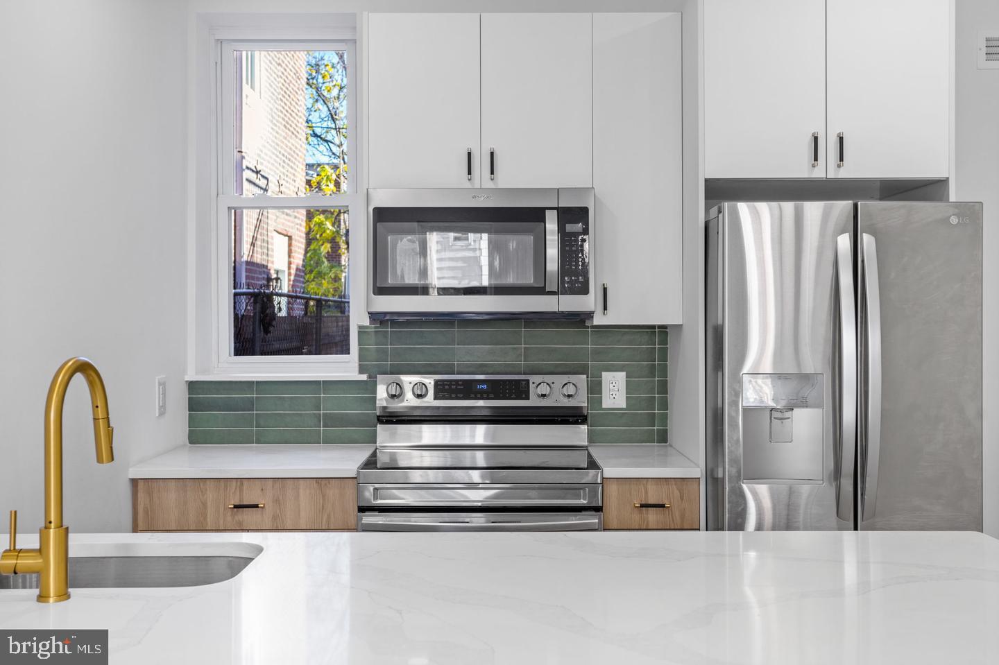 This renovated property, located at 1833 S 20th St #1 in Philadelphia, PA, is a fully upgraded unit situated in the West Passyunk/Point Breeze area. Featuring two generously sized bedrooms, a complete bathroom, and a modern kitchen equipped with stainless steel appliances, contemporary cabinets, and quartz countertops, this unit also comes with convenient in-unit washer/dryer facilities. The first-floor unit offers access to a spacious backyard and includes access to the basement space for storage and potential alternative uses.