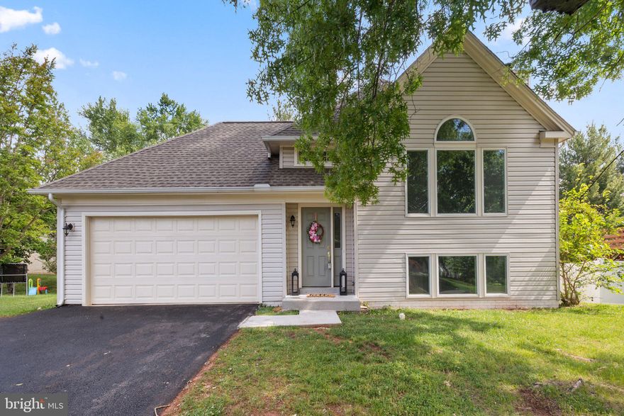 Welcome to 14516 Oak Cluster Drive in Centreville—an exceptional opportunity to own a beautifully updated home in an unbeatable location with NO HOA! Tucked away on a quiet cul-de-sac street, this move-in ready home offers 4 bedrooms, 2 full bathrooms, and a 2-car garage—the kind of combination buyers are always searching for.
From the moment you step inside, you're welcomed by a beautiful modern staircase that creates an impressive first impression and sets the tone for the stylish updates throughout. The bright, open living room features soaring vaulted ceilings and large windows that flood the space with natural light, creating a warm and inviting atmosphere. Fresh paint throughout, brand new highly durable LVP flooring on the upper level, new carpet in the bedrooms, updated light fixtures, and thoughtful upgrades make this home truly move-in ready.
The kitchen has been refreshed with a brand new stove, refrigerator and granite counter tops!
Major big-ticket updates have already been taken care of, offering peace of mind for years to come, including a fully renovated bathroom on mail level, a roof (2017), new vinyl siding (2017), fully fenced 6’ vinyl privacy fence (2023), new asphalt driveway (2025), garage door (2025) and Andersen picture windows—adding both curb appeal and long-term value.
Step outside to enjoy the flat, fully fenced backyard—perfect for entertaining, pets, play, or simply relaxing in your own private outdoor retreat.
Located just minutes from I-66, Route 28, and Route 29, and close to Trader Joe’s, shopping, dining, parks, and Dulles International Airport, this home offers the convenience today’s buyers want with the updates they don’t have time to take on themselves.