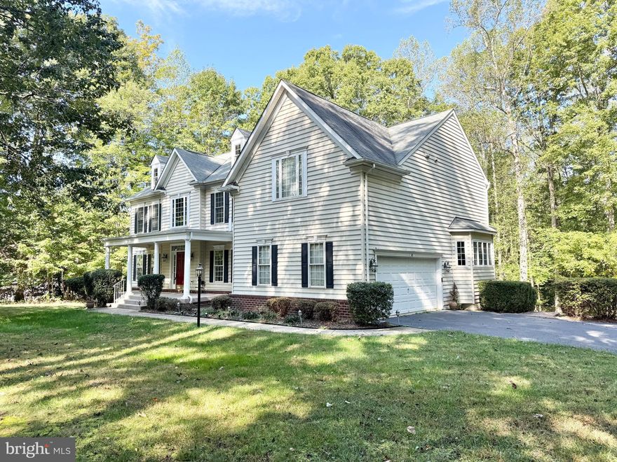 Beautiful and secluded estate home located in the sought-after Hunters Pond community and in Mountain View High School district (walk to school!) . Filled with abundant upgrades this elegant home has plenty of room for living with 6 bedrooms and 4.5 baths that are nestled on a private 3.18 acres. A long driveway hidden with trees, 2-car side-loading garage, multi-level composite deck, stamped concrete patio, high ceilings, hardwood floors, an abundance of windows to let in loads of natural light throughout. A gourmet kitchen, morning room, dual staircase, main level bedroom, and a fully finished lower level with pool table included, and a full kitchen and bar. A two-story foyer entry with gleaming hardwood flooring that continues into the formal living room a nd kitchen. Formal dining room. The gourmet kitchen with large kitchen island, ceramic cook top, double oven and gorgeous granite countertops and breakfast nook with an adjoining morning room. Gas fireplace in the family room and French-style door granting access to the expansive custom deck with descending stairs, a stamped concrete patio and yard with a shed, all surrounded by woodlands. Large owner's suite boasting plush carpet, room for a sitting area, dual walk-in closets with custom organizers, and a luxurious en suite bath featuring dual vanities, a makeup vanity, water closet, soaking tub, and glass-enclosed shower. Upstairs has three additional bedrooms each with lighted ceiling fans and ample closet space and a Jack-and-Jill bathroom. The expansive walkout lower level built-in wall/ceiling speakers delivers plenty of space for a multitude of activities with a recreation room and not forgetting the 2nd full kitchen with beautiful blue-veined white quartz countertops. Dual sliding barn style doors open to a fabulous media/family room with twin windows, while a legal 6th bedroom, an additional full bath, a workout room, and an unfinished area with loads of storage space completes the comfort and luxury of this wonderful home. All this in a peaceful residential setting with a pathway to Mountain View High School at the end of the street. Easy access to I-95 and Quantico.