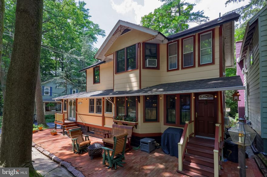 Welcome to this year-round Mt. Gretna Campmeeting cottage!! This 3-bedroom, 1.5-bath home is thoughtfully designed for all-season living, The enclosed wrap-around porch offers the ultimate in low-maintenance indoor/outdoor living — no worries about pollen in the spring or snow in the winter — making it an ideal space for relaxing, entertaining, or simply enjoying the peaceful setting. The newer windows and a large, clean, and dry basement add to the low maintenance lifestyle. A custom kitchen with handcrafted cabinetry, granite countertops, and the newly remodeled luxury bathrooms are stand out features! All Appliances included! Located on a quiet, drivable street with available on-street parking, A great Mt Gretna opportunity at 207 Dickson Ave!