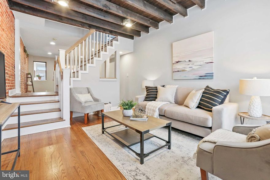 RECENTLY RENOVATED HOME LOCATED IN THE HEART OF PATTERSON PARK ON SOUGHT AFTER AND QUIET BLOCK WITH OVERSIZED OFF STREET PARKING PAD. GLISTENING FINISHED IN PLACE HARDWOODS CASCADE THROUGHOUT. ENJOY WHITE CABINETRY WITH CUSTOM BUILT INS, UPGRADED TRIM AND PAINT PACKAGE, IMPORTED TILE, GRANITE COUNTERTOPS, SS APPLIANCES IN OPEN CHEF'S KITCHEN. TONS OF NATURAL LIGHT. EXPOSED BRICK. FINISHED LOWER LEVEL WITH SECONDARY GREAT ROOM - GREAT FOR THIRD BEDROOM, GYM, OFFICE, OR PLAYROOM. HIGH CEILINGS. TONS OF STORAGE. WALK-IN SHOWERS. WALK-IN CLOSETS. SPACIOUS 3 BEDROOMS WITH 2 FULL BATHROOMS. CLOSE PROXIMITY TO RETAIL SHOPPING, LOCAL DINING, PATTERSON PARK, AND ALL MAJOR HIGHWAYS. SCHEDULE A PRIVATE TOUR TODAY.