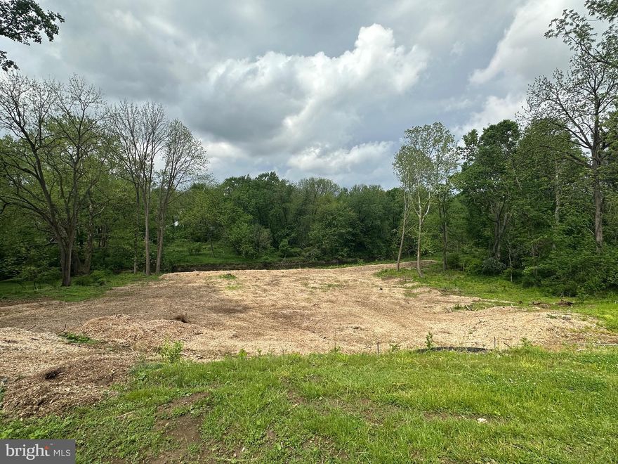 Exceptional New Listing: Custom Modern Tudor Home in School Lane Hills, Lancaster
Location: School Lane Hills, Lancaster
Builder: Costello Custom Homes
Lot Size: 1.6 acres

We are delighted to present an extraordinary opportunity to build your dream home in the prestigious School Lane Hills neighborhood of Lancaster. This stunning “Modern Tudor-style” residence, set to be built by the acclaimed Costello Custom Homes, will sit on a breathtaking 1.6-acre wooded lot overlooking the Little Conestoga Creek. With expansive views to the west, this property offers the perfect backdrop for spectacular sunsets that you can enjoy from the comfort of your home.

Architectural Brilliance
This thoughtfully designed home will feature nearly 5,000 square feet of finished living space above grade, showcasing a harmonious blend of traditional Tudor charm and modern functionality. The architect has emphasized open spaces and natural light, incorporating impressive 10-foot ceilings and expansive walls of glass that not only invite the outdoors in but also provide breathtaking views of the creek and surrounding woods. Renderings of the home illustrate the exquisite details that will make this residence a true masterpiece.

Opulent Interior Features
As you step inside, you will be greeted by a grand foyer that leads seamlessly into the expansive great room. This impressive space is characterized by high ceilings, a cozy fireplace, and massive glass windows that overlook the terrace and the stunning landscape beyond. The integration of indoor and outdoor living spaces creates an inviting atmosphere, perfect for hosting family gatherings or entertaining friends.

Gourmet Kitchen

The heart of the home is undoubtedly the expansive gourmet kitchen, designed to be both functional and stylish. Featuring a large central island that serves as a focal point, the kitchen is perfect for culinary creations and casual dining. The design includes a generous walk-in pantry, ample cabinetry for storage, and a convenient mudroom that adds practicality to daily living. Whether you are hosting a dinner party or preparing a family meal, this kitchen is equipped to handle it all with ease.

Luxurious Primary Suite
The first-floor primary suite serves as a serene retreat, complete with a spacious layout, a large walk-in closet, and a beautifully appointed custom bath. This luxurious bath features a tile shower, a soaking tub for ultimate relaxation, and double vanities for convenience. The thoughtful design ensures that this suite is a private oasis, perfect for unwinding after a long day.

Thoughtfully Planned Layout
In addition to the primary suite, the first floor includes a private office, which features elegant glass doors that open onto the terrace, creating a peaceful workspace surrounded by nature. The first floor also boasts a dedicated laundry room, enhancing the ease of one-floor living and making everyday tasks more manageable.

Second Floor Design

The second floor is designed with family comfort in mind, featuring three spacious bedrooms, two full baths, and a versatile loft area that can be adapted to meet your family's unique needs. One of the bedrooms includes a charming balcony that captures the breathtaking western views, making it a perfect spot to enjoy morning coffee or evening sunsets. This thoughtful layout provides privacy and comfort for family members or guests, ensuring everyone has their own space.

Expansive Outdoor Living
The rear terrace is a stunning feature of this home, providing an ideal space for outdoor entertaining and relaxation. Imagine hosting summer barbecues, enjoying al fresco dining, or simply unwinding with a book while surrounded by nature. For those envisioning a luxurious lifestyle, the option for an infinity-edge pool can be incorporated, creating a private retreat that enhances the outdoor experience.

Versatile Daylight Lower Level
The large daylight lower level offers incredible potential for