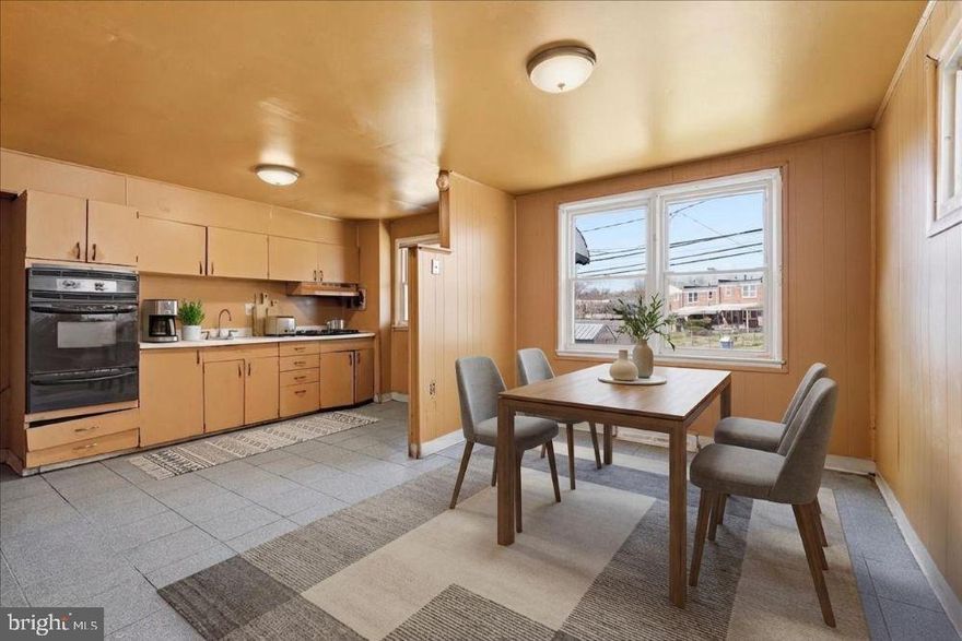 Solid Brick End Unit Rowhome Offering Classic Charm and Exceptional Potential. This Well-Built Home Features Hardwood Floors, a Finished Walk Out Basement Providing Additional Living Space, and a Covered Front Porch Perfect for Relaxing and Enjoying the Neighborhood Setting.  The Fenced Backyard Offers Privacy and Room for Outdoor Entertaining, Gardening, or Pets.  With Strong Bones and Desirable Features Already in Place, This Property is an Excellent Opportunity for Buyers or Investors Looking to Add Value Through Cosmetic Updates and Personal Touches. Don’t Miss the Chance to Transform this Home into Something Truly Special. Sold As-Is..