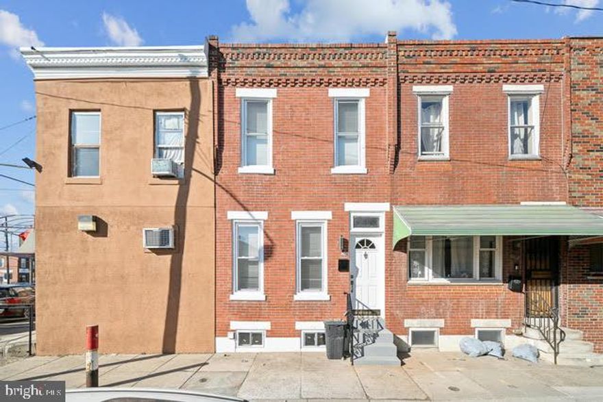 Welcome to this beautifully renovated 2-bedroom, 1-bathroom row home in the highly sought-after Lower Moyamensing neighborhood of South Philly! This charming home features a spacious living/dining area with an exposed brick wall that adds character and warmth. The modern kitchen boasts stylish grey cabinetry, quartz countertops, stainless steel appliances, and a built-in microwave. Step out the rear door to a private yard, perfect for entertaining or enjoying a BBQ. Upstairs, you'll find two cozy bedrooms and a sleek 3-piece bathroom. The full unfinished basement offers laundry hookups and plenty of storage potential. Located just a short walk from the stadiums, FDR Park, and major public transportation, this home is a true gem with a Walk Score® of 90! Don’t miss out on this incredible opportunity to live in one of the most desirable areas of South Philly. Schedule your appointment today!
