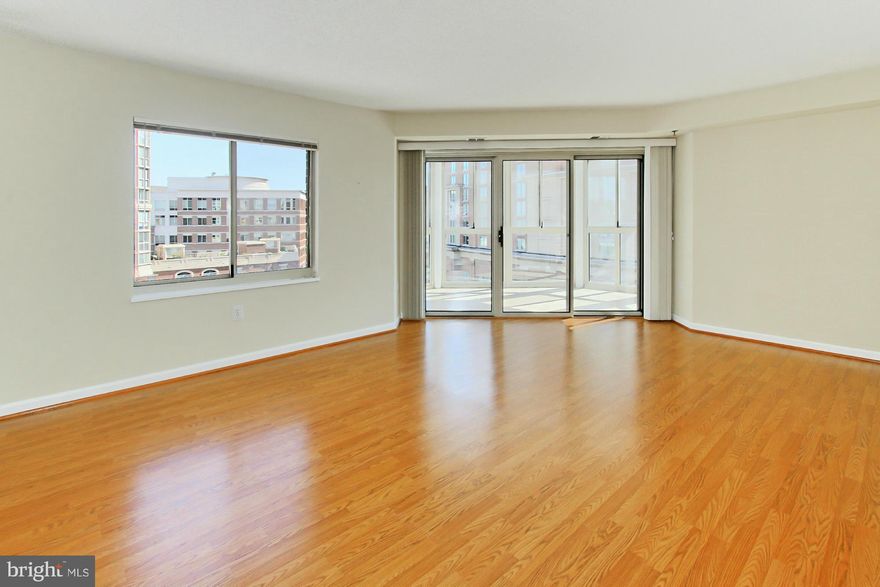 3 BR, 2 BA fantastic rental wood floors in LR, DR & Kit, new BR carpet, professionally painted. Located in the 'South' building w/24hr front desk. MBR has great view, walk-in closet, WP tub & dual vanity. Incl TWO garage & storage. Encl Bal not incl 1479 sqft. Walk to metro, Whole Foods, movies, restaurants & shops. Enjoy 2 gyms, pool, tennis, putt green, 24hr security, etc.