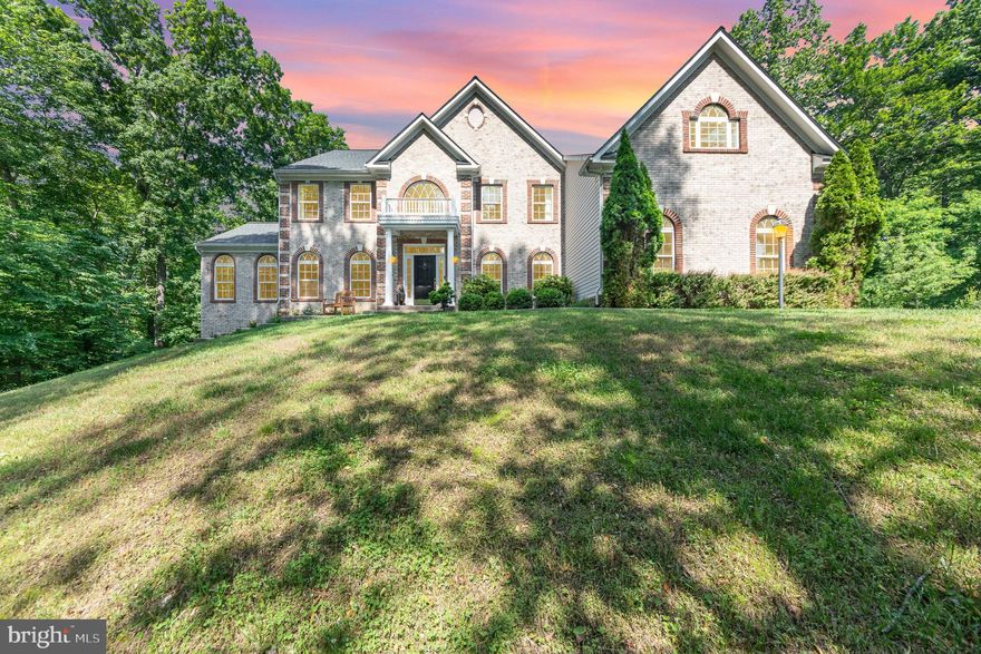 The aerial pictures here showcase the privacy and peaceful living offered in this Poplar Hills estate home. This home has $158,075 in renovations. Here are some featured items: 3.8 acres on a wooded corner lot, total square footage: 6,068 total, and 5,761 finished on a quiet cul-de-sac. There is a gourmet kitchen with upgraded appliances (2025) and a breakfast nook, first floor office, a main circular staircase and second staircase leading directly to the kitchen. There is also a sunroom with UV protected surround windows, family room with a cathedral ceiling and UV protected windows, two gas fireplaces, 400 AMPS of electrical service with generator backup and subpanel, 3-car garage plus workspace, roof replacement with 50-year architectural shingles (2017), all hardwood on the main and 2nd floors, replacement (2017 and 2023) dual zone high efficiency upper and lower heat pumps maintained twice a year. The 75-gallon water heater was replaced in 2022. The rap around stamped concrete patio, pads and steps were added 2016-2017, other additions include the greenhouse and storage shed, 3 levels of upgraded decking, a complete water treatment system, 90% finished basement with a media room or optional 5th bedroom, exercise room, recreation room with a lounge nook, full bathroom, and storage room. This house is adjacent to a vacant lot. The interior was painted 5/25. The Virginia Railway Express Brooke Station is 2-miles from this home. The complete rundown of renovations and improvements are in the documents section.
