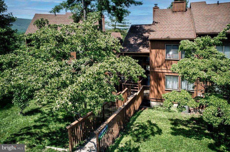 Schedule your tour today to come see this updated 2 bedroom 2 bathroom condo with easy walk in access (don't deal with multiple stairs!) by Lake Laura at Bryce Resort!  The kitchen was fully updated in late 2018/early 2019 with excellent storage and counter space, and full sized appliances.  Just off the kitchen, you will find the open concept living/dining area with wood burning fireplace.  Enjoy sitting by the fire after a day on the slopes, or hang out on the large covered deck just off the living room after a trip to Lake Laura, hiking, or golfing and mountain biking at the resort.  

Both bathrooms (hallway full bath and ensuite bathroom) were also recently renovated with updated fixtures in 2021.  Bonus- unlike some other condos on The Hill, this condo also has the added convenience of a washer/dryer (less than 3 years old) in the unit!

This 2nd floor condo has easy walk in access from the main parking area  (don't have to deal with multiple stairs!).