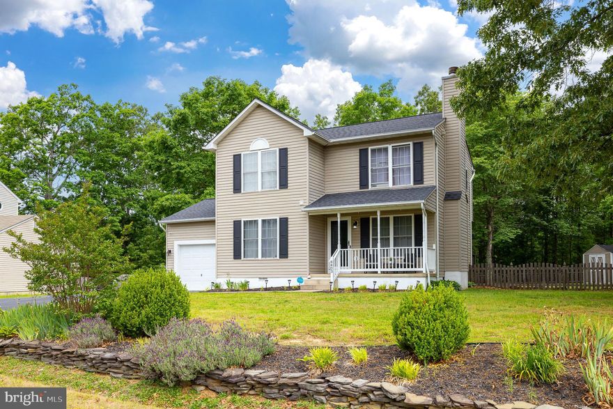 Welcome Home! Situated on a .38-acre lot, this 3-bedroom, 2.5 bath home features a welcoming covered porch…a perfect setting to enjoy the outdoors!  Upon entering the home, you are greeted with contemporary flooring that continues throughout the main level.  The family/living room is generous in size and features a wood burning fireplace!   The open kitchen has a pantry, an area for a kitchen table and direct access to the backyard deck!  The main level also features a separate dining room and a half bathroom!  The primary en-suite bedroom boasts a walk-in closet and a private full bathroom with a double vanity and a shower/tub with attractive tile surround!  The laundry area is on the 2nd level where all the bedrooms are located! But wait…there’s more!   The fenced-in backyard has a shed for additional storage and backs to trees for privacy and tranquility!  The backyard is an open canvas to create your own oasis!  Located near shopping, restaurants, Rt 1 and more!  Don’t miss out!