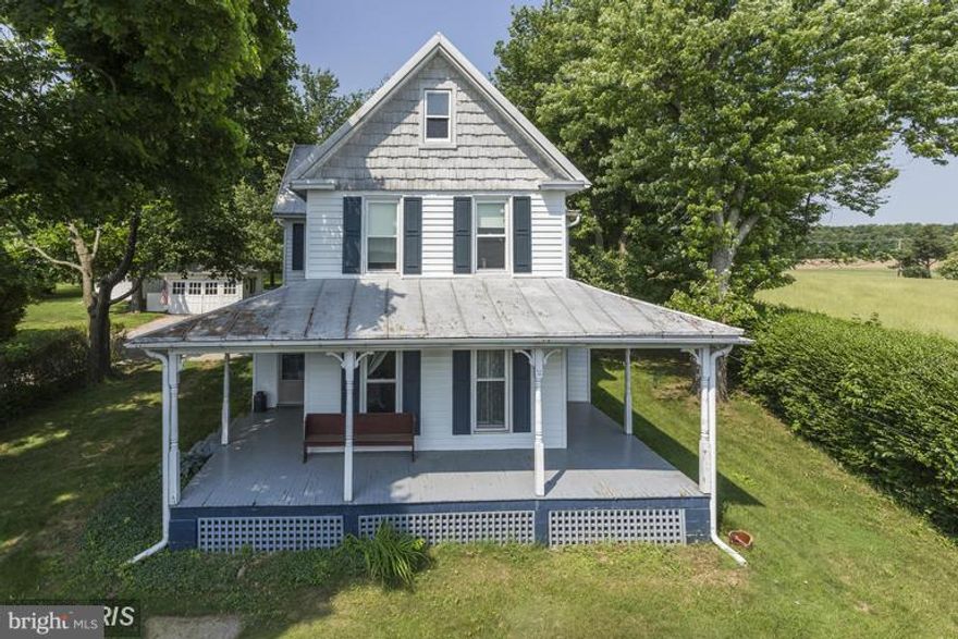 Beautiful farmhouse with original charm and many updates. Gorgeous  lot with detached garage and outbuildings. Updated electrical service, plumbing and boiler system.  Refinished hardwoods and fresh paint throughout.  New kitchen and appliances. All rooms are very large.laundry main level. All work done with permits. Well and septic reports available. Being sold in AS-IS but is in great shape