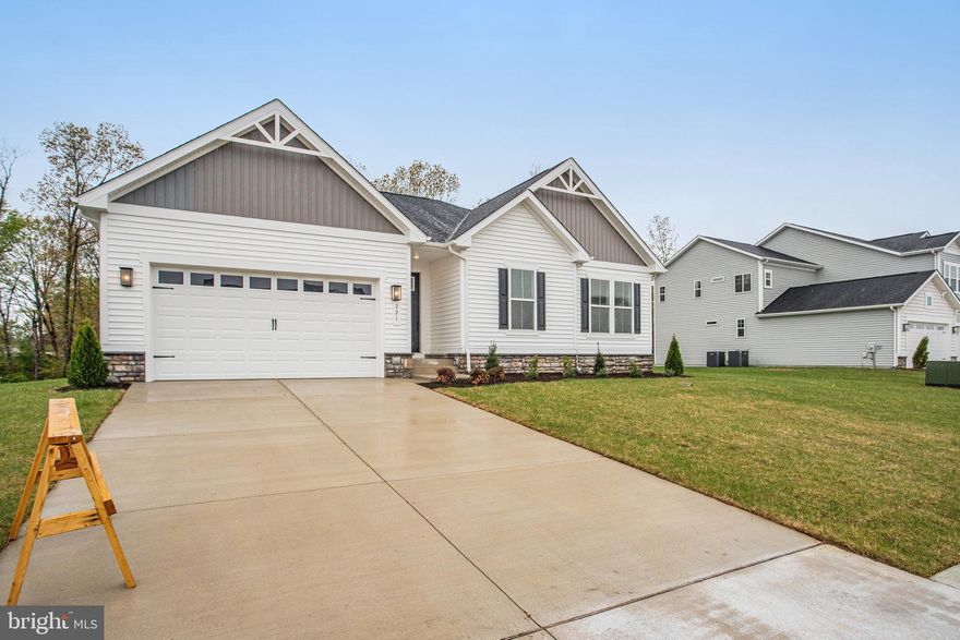 Highlights of this ranch-style Decker plan include a spacious great room with adjacent sunroom.  The gourmet kitchen has a huge island, upgrade cabinets with loads of storage, quartz countertops, 5 burner gas cooktop with pyramid hood vent above, and walk-in pantry.  The lavish primary suite has a large walk-in closet, private bath which has both a walk-in shower with built-in seat and a separate soaking tub.  Additionally, there are two more bedrooms on the main level, another full bath and also a laundry room.  In the basement there is a huge recreation room, full bath, bedroom and loads of storage space.