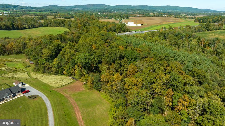 Embrace the beauty of rural living with this fantastic opportunity to own more than 7 acres of stunning land, complete with breathtaking views and the perfect blend of privacy and convenience. With perc approval already in place, you can confidently bring your own builder now or later, giving you the flexibility to design and construct the home you've always envisioned per township approval. Not only could you build your dream house but this lot offers hunting and fishing opportunities as well! You could own 700+ feet of Latimore creek, which is a stocked trout stream that runs through the property. Don’t miss out on the chance to create your perfect sanctuary!