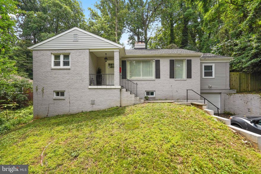 Location, location, location! This home is conveniently located in Sligo Park Hills. This home features a fantastic brick exterior that makes a beautiful first impression. Inside you will be greeted with a large living room with hardwood floors, plenty of natural sunlight accented by a brick fireplace. The kitchen offers granite countertops, stainless steel appliances, and beautiful modern cabinetry. The basement is fully finished with a full-size bathroom, kitchenette, bar area, family room, and storage space. The attached garage is accessed through the basement and the driveway. Enjoy the outdoors with the large patio - perfect for entertaining or enjoying the private yard. Conveniently located just minutes away from the metro, shopping, and dining. Walking distance to Sligo Creek, biker trail, parks, and playgrounds. Don't miss this one! Schedule a private showing today!