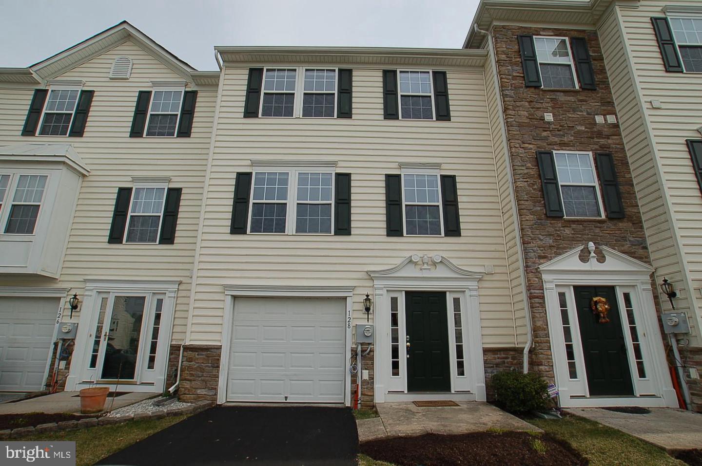 Welcome to 128 Larose Drive, a beautifully maintained townhome in the highly desirable Round Hill Community. This thoughtfully designed 3-bedroom, 2.5-bath home offers three levels of comfortable living space.
The entry level features an inviting foyer with access to the one-car garage, a convenient half bath, laundry area, and a spacious storage room that could easily be transformed into a home gym or office. You will also find another door with access to the rear yard—perfect for relaxing outdoors.
Upstairs, the main level boasts an open floor plan with a bright and airy living room, a dining area, and an eat-in kitchen. The kitchen is highlighted by a center island, timeless cabinetry with ample storage, decorative lighting, and a floor to ceiling covered pantry. Glass doors from the living room lead to a private rear deck, an ideal spot to enjoy your morning coffee or unwind at the end of the day.
On the upper level, you’ll find a serene primary suite complete with a full en-suite bath, with soaking tub and shower. Two additional generously sized bedrooms and a well-appointed hall bath complete this floor.
The Round Hill Community takes care of the details for you—the monthly fee covers roof and siding maintenance, lawn care, landscaping, shrub trimming, weeding, pressure washing, and snow removal in the common areas.
*There is currently a tenant living in the property. Photos of are from the unit before the tenant moved in.