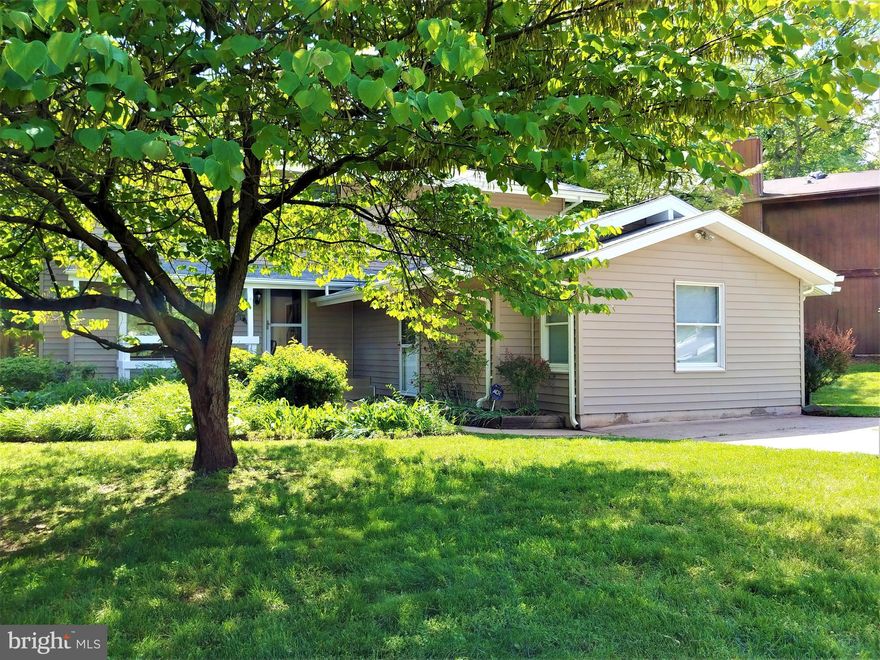 Incredible home   incredible location.  Convenient to Dulles Town Center, Dulles International Airport, Routes 7 and 267, and the Capital Beltway!  Take advantage of this unique opportunity to own a single family home on a 1/4 acre lot with a full and separate private apartment. The possibilities are rare indeed! Perfect for an In-law suite, au pair suite or college student! It's private and perfect with a large bedroom, full sized kitchen, large full bath and a living dining area! The home features fresh paint, new carpeting, refinished hardwood floors, 2 new vanities, new microwave and refrigerator.  Enjoy the brick outdoor grill, large back deck, cozy front porch, wood burning fireplace, extra-large family room off the kitchen with gleaming hardwoods that leads to a back deck, lush mature landscaping, new lighting,  recently installed siding, and a fully fenced backyard.There is only one home with all these features, make it yours!