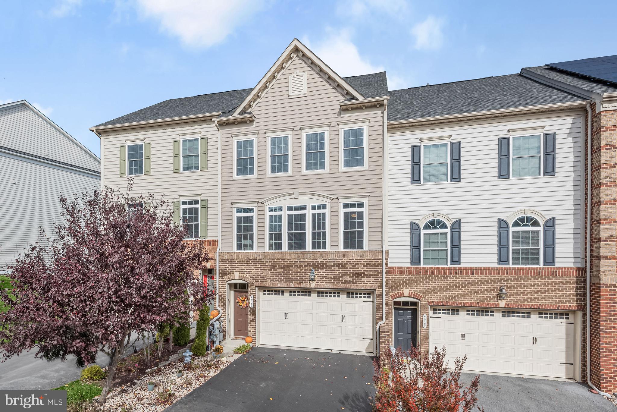 Welcome to this exquisite brick-front, 3-level townhome nestled in the picturesque Autumn River community. Located on a tranquil no-through street, this home offers exceptional views and privacy, as it backs onto the lush Patapsco Park. Enjoy numerous community amenities, including a clubhouse, a refreshing pool, a kid's pool with a delightful water feature, a playground, and tennis courts. Convenience is key, with proximity to Historic Ellicott City, major commuter routes, shopping, and the convenience of BWI Airport just minutes away. Step inside, and you'll be greeted by beautiful hardwood floors throughout the home, fresh neutral paint in the main living spaces, and upgraded trim and lighting. The open concept kitchen, dining room, and family room are bathed in natural light, featuring a cozy fireplace and two atrium doors with transom windows. The kitchen is a chef's dream, boasting 42-inch cabinetry, granite counters, a subway tile backsplash, stainless steel appliances, and an oversized island with a breakfast bar. The adjacent dining room offers board and batten trim, adding a touch of elegance to your meals. A spacious living room with lofty windows and transoms provides an inviting space for relaxation. The top floor houses a primary bedroom with two walk-in closets and an en-suite bath with a double vanity, soaking tub, and tiled shower. Two additional bedrooms, a full bath, and a laundry room complete the top floor. The lower level is a hidden gem, featuring rare 13ft ceilings, making it the perfect recreation room with a new full bath. Plus, enjoy the convenience of a two-car garage and a low-maintenance exterior. Don't miss your chance to make this your new home! Property Updates: Kitchen vent hood, removed all carpeting and replaced with hardwoods, and lower level bath.