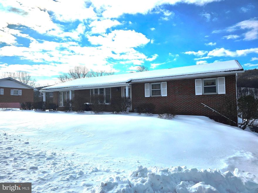 Nestled in the serene Valley View subdivision, this charming ranch-style home offers a perfect blend of comfort and functionality. Built in 1967, this well-maintained brick residence boasts 1,363 square feet of thoughtfully designed living space on the main floor, featuring four spacious bedrooms and two full bathrooms, ideal for both relaxation and entertaining. Step inside to discover a sunroom with 3 walls of windows allowing tons of natural light to flow through. Next venture down to a fully finished basement that expands your living area, providing endless possibilities with a family room with bar area, a bedroom, a small office area, laundry area, and full bath. The inviting layout flows seamlessly, creating a warm atmosphere that feels just like home.  Park your car in the detached garage that provides convenient parking and additional storage.  Use the attached breezeway (enclosed porch area) to get into the house. The additional sheds add even more utility to this delightful property.  The rear backyard is fenced in and the lot goes beyond the fenced area. The expansive lot consists of 2 parcels (includes tax id 04 7C003500000000) for a total of 0.92-acre that offers ample outdoor space for gardening, play, or simply enjoying the tranquility of nature where you will even find a brick fireplace BBQ. With its classic architectural style and solid construction, this home is not just a place to live, but a canvas for your personal touch. Imagine cozy evenings spent in your backyard, or hosting gatherings in your spacious living areas. Located in a peaceful neighborhood, this residence is close to local amenities, ensuring that everything you need is just a short drive away. Experience the perfect blend of comfort, space, and community in this inviting home. Don’t miss the opportunity to make it yours!
Note- Central air is in upstairs only.  Upstairs heats with natural, gas downstairs has electric baseboard heat.