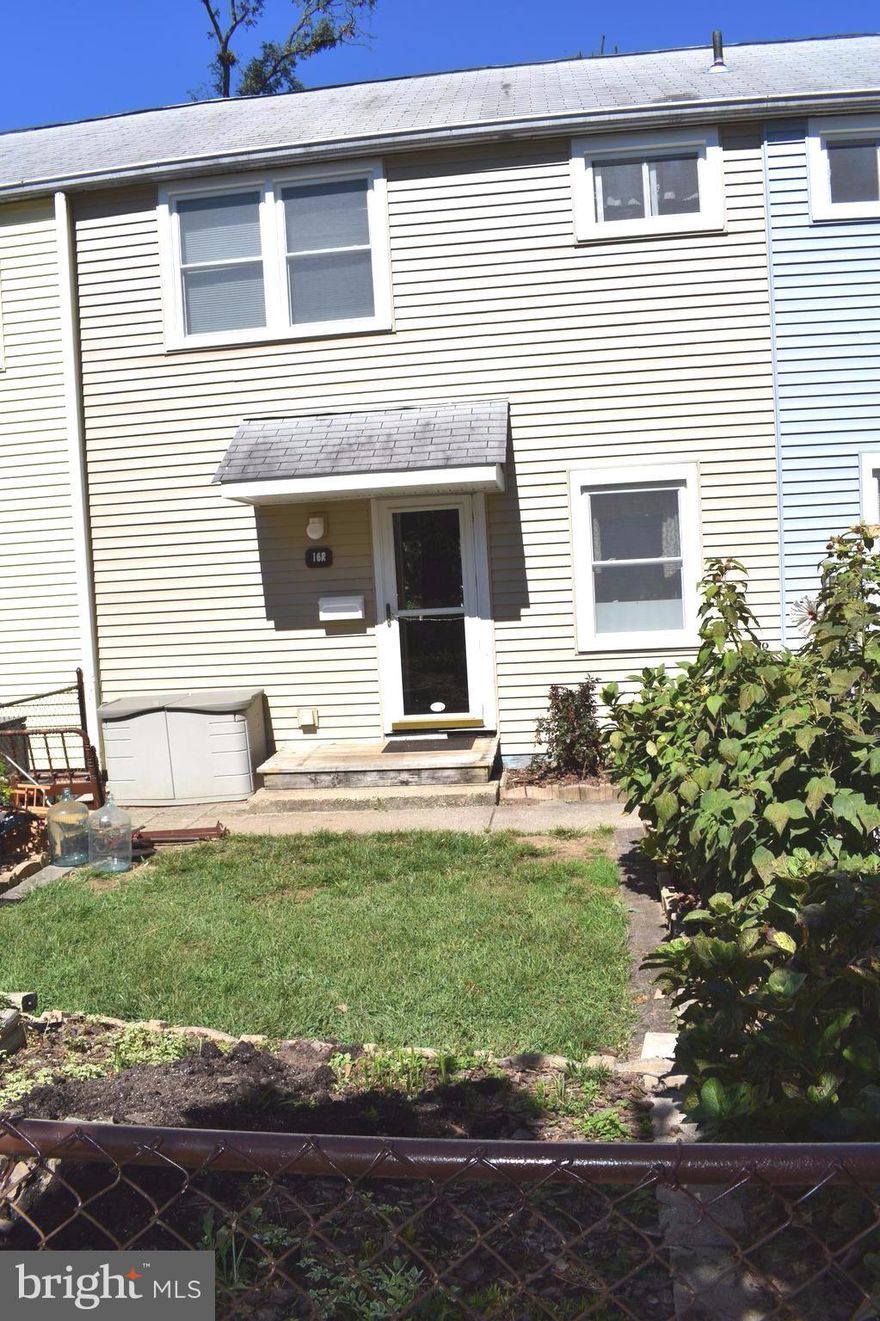 You won't be disappointed in this well maintained 3 bedroom unit with spacious kitchen, heat pump, storage closet, hardwood floors, bookcases, built-in storage in the smaller bedroom, storage shed, perennial flowers, stone patio and fenced yard.  The new baseboard heaters, new windows and new vinyl siding are already completed.  The new front door will be installed.