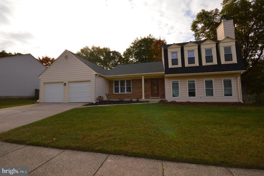 This beautifully maintained and spacious single-family home offers 4 bedrooms, 3 full baths and a large den (which includes a full bath) off the family room that can be converted into a fifth bedroom. Features include an eat-in kitchen and a cozy family room with a fireplace. Gleaming hardwood floor enhances the main level with luxury vinyl in the family room and den. Upstairs, you will find a spacious primary bedroom with a walk-in closet and 3 additional generously sized bedrooms. Features include a cathedral ceiling which gives a spacious and airy experience, a large deck, 2 car garage and a private fenced backyard. Recent updates include a new roof (2021), new HVAC system (2019), and newer deck, appliances, washer and dryer. 
This home is just 3 minutes from the Dulles Toll Road and the vibrant Worldgate Center, with its array of shops, restaurants, gym, and AMC movie theatre. It is only 10 minutes walking distance from Innovation Center Metro and 8 minutes drive to the Old Town Herndon, the Herndon Centennial Golf Course, and the Herndon Community Center.