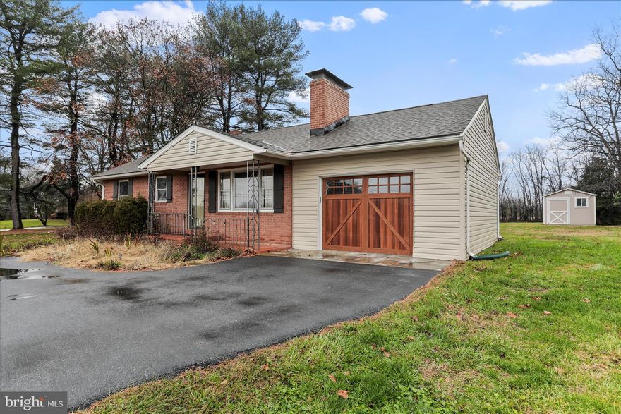 Welcome to this beautifully maintained all-brick rancher situated on a picturesque one-acre lot surrounded by pastoral and mountain views. Offering two bedrooms and one full bath, this home provides comfortable single-level living in a peaceful rural setting while still being conveniently located.
Step outside and discover the property’s standout feature—an impressive, recently built 30' x 48' x 16' top-of-the-line pole barn. Perfect for hobbyists, contractors, car enthusiasts, or RV owners, this structure includes: separate underground electric service, fully insulated interior, epoxy-coated concrete floors, two mini splits to condition the space, four overhead garage doors with remotes for easy access and a dedicated office space. You are sure to be impressed, Additional exterior features add even more value, including an RV dump station with water supply, rear chain link fencing, and a storage shed that conveys with a riding lawn mower.  Enjoy peaceful mornings and quiet evenings surrounded by serene landscapes, open skies, and the tranquility of country living. This property combines charm, functionality, and privacy—a rare find in a truly serene location.  Close to the ammenities of Shepherdstown, you will find downtown Shepherdstown feels like stepping into a well-kept 18th-century village. Most of the buildings are historic, and everything is close together, so you can park once and explore on foot. Expect unique  storefronts and lots of preserved architecture. You can wander without a plan and enjoy all the town has to offer. Most cafés, shops, and restaurants are within a 5-minute stroll of each other. The town feels peaceful and lived-in — not touristy or commercial.P op into a local book store with character, find handmade crafts and local art, antiques and vintage treasures, outdoor and bike shops, cozy gift shops and specialty stores. It’s the kind of town where you walk into a store and end up chatting with the owner. If this sounds like something you are looking for, schedule your showing today and make this your home.