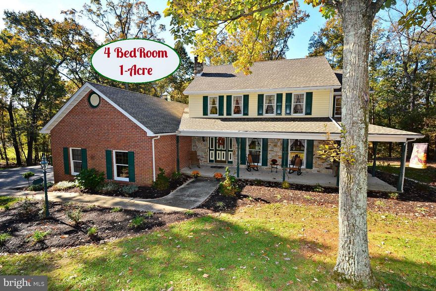 Custom Built Home - with Many Up Grades -2 Acres Wooded Location - Open Floor Plan - Stone Fire place  in Family Room - Granite Kitchen Counters - Double Ovens Formal Dining 1room with FrenchDoors- 4 bedrooms  2.5 Bath - Master Suite with GardenTub- Wrap Around Porch and 2 Tier Deck - Stone Entrance to Driveway - full Basement Easy Access to Maryland