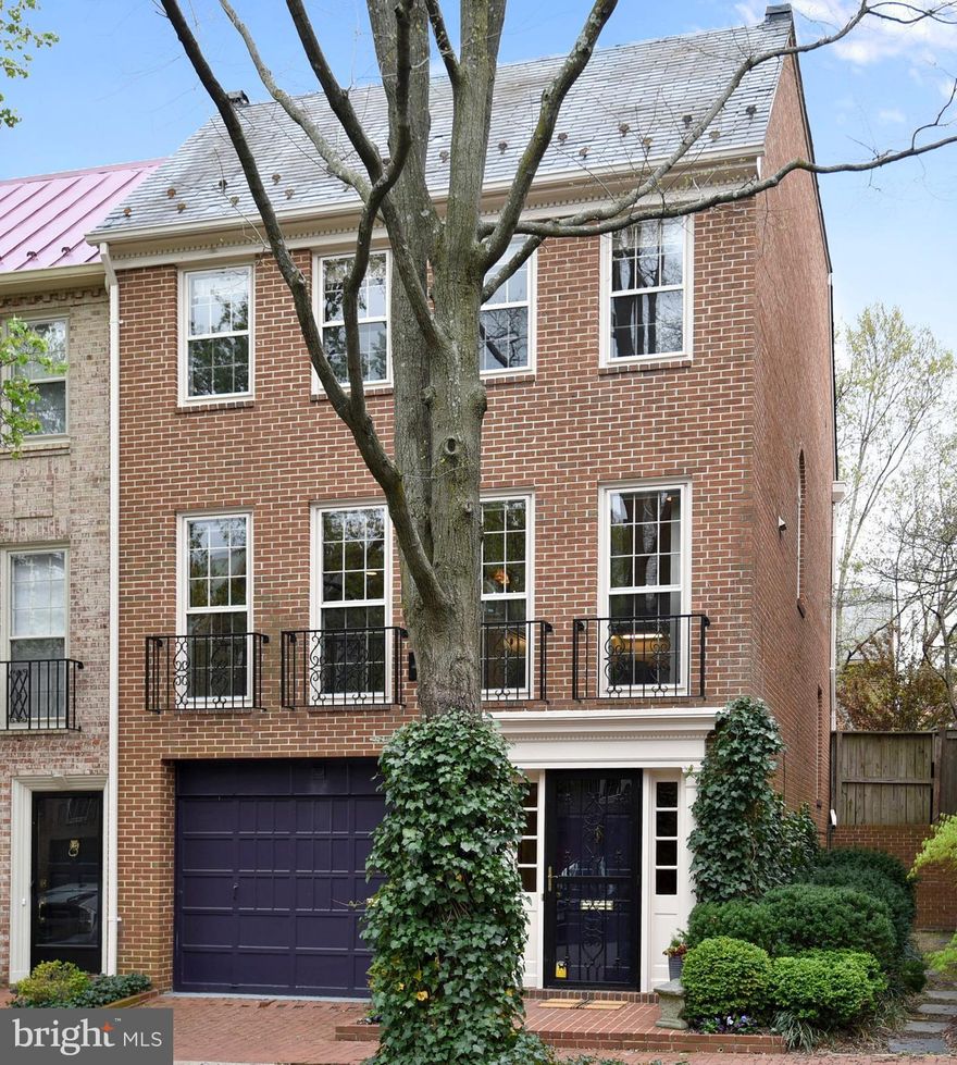 Gorgeous 4-level brick TH just 50 yards from the waterfront. Spectacular living room w/ 12' ceilings, separate dining room, spacious kitchen with table space, lower level family room, 4 bedrooms incl master bedroom & master suite & 3.5 renovated bathrooms. Pretty fenced garden.River views from master suite, gleaming HWD floors, 2 FP's. extensive storage,1-car garage & driveway parking for 2nd car.