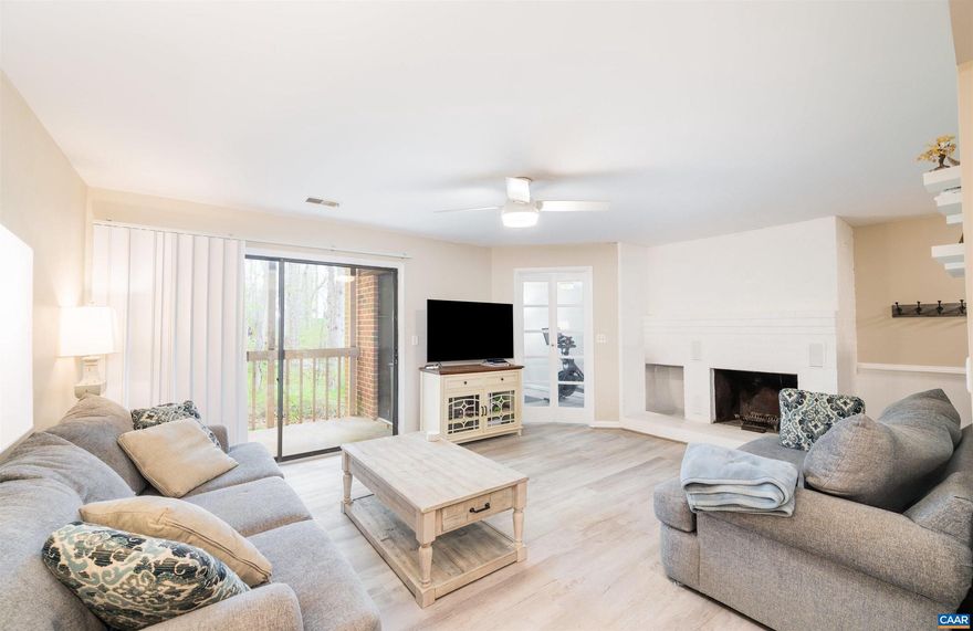 This newly renovated and freshly painted 2-bed, 2-bath, 1,120-fin sq ft first floor condo features an attached storage shed, balcony with unparalleled private wooded views,  a quaint solarium/sun room (which could be utilized as a third bedroom, home office, nursery, and/or exercise room) and cozy living room wood-burning brick fireplace! Enjoy the newer HVAC system, washer, dryer, luxury vinyl plank main area flooring, bedroom carpet flooring, light fixtures throughout, hot water heater, doors, trim, and the smooth, popcorn-free, modernized ceiling! Utilize the balcony shed for storage space and prepare meals in the recently renovated alley kitchen, featuring new white cabinets, hardware, countertops, disposal, appliances, and lighting! Conveniently located within Turtle Creek Condos neighborhood with luxury resident perks such as a community pool, tennis, gym, and clubhouse amenities as well as water/sewer, trash pickup, and exterior, area, and fireplace maintenance covered! Just minutes from Barracks Road/Shops at Stonefield/Seminole Trail shopping centers, UVA, and more! OPEN HOUSE SUNDAY 04/14 12-2PM!,Formica Counter,White Cabinets,Bus on City Route,Fireplace in Living Room