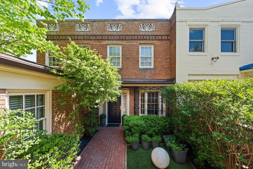 Primely situated in the heart of prestigious Kalorama, this turnkey residence seamlessly blends timeless elegance with thoughtful modern updates across approximately 3,108 total square feet of beautifully finished living space. Offering 4 Bedrooms, 3.5 Bathrooms, lush gardens, a beautiful backyard, and coveted up to 3-car parking, the home presents an exceptional opportunity to enjoy refined city living with remarkable indoor-outdoor connectivity in one of Washington's most sought-after neighborhoods. Designed for both elegant entertaining and comfortable daily living, the home showcases gracious living spaces accented by refinished hardwood floors, tall ceilings, updated lighting, and beautifully improved architectural details throughout. The main level features a formal dining room and gracious living room adorned with a fireplace and floor-to-ceiling french glass doors that unveil a balcony overlooking the beautiful rear lush gardens and provide the space with an abundance of natural light. The renovated Kitchen has been thoughtfully enhanced with refreshed cabinetry to maximize storage, new L-shaped countertop, and new appliances. Upstairs you will find the Primary Suite which features a luxurious spa-like bathroom and dressing suite. Two additional bedrooms with a shared bathroom complete the floor. One of the three bedrooms on this level is currently used as a home office with a full wall of built-in storage and shelving. The fully remodeled lower level offers incredible flexibility with the fourth Bedroom and a fully renovated Bathroom, sizable entertaining space, new flooring, and a newly designed Laundry Room with new full size smart washer and dryer.  Seamless indoor-outdoor living unfolds across the home’s beautifully landscaped grounds, where lush gardens and a serene backyard create an incredibly private urban retreat. Extensive recent improvements, including façade restoration, a new front gate, new roof, added skylights, new air conditioning system and humidifier, and a new water heater, further elevate this turnkey offering. Complete with an attached 1 car garage plus up to two surface parking spots, this beautiful residence has it all! Don't miss out on this rare opportunity!