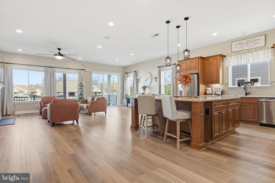 ***Open House Sat 5/9 12:00-3:00***<br>Some homes feel impressive the moment you walk in. This one keeps that feeling going. From the sun-filled main level to the finished lower level designed for entertaining, 117 Pintail Way feels less like a downsize and more like a lifestyle upgrade.<br>Built in 2021 in Trilogy at Lake Frederick, this Shea Evoke model has the polished, model-home feel buyers love, with a layout that lives beautifully day to day. The main level is open, warm, and easy to move through, with wide-plank flooring, generous natural light, and connected spaces for cooking, dining, relaxing, and hosting.<br>The kitchen sits at the center of it all, with rich cabinetry, an oversized island with seating, stylish lighting, and a layout that naturally draws people in. The great room is anchored by a striking stone fireplace, while large windows and doors connect the indoors to the expansive covered patio.<br>Stretching nearly 50 feet across the rear of the home, the covered patio feels like an outdoor living room with space for morning coffee, casual dinners, evening drinks, or a cool drink after pickleball with friends.<br>The main level lives beautifully with a spacious primary suite, a second bedroom with an ensuite bath, plus a third bedroom and additional full bath. A flex space adds versatility for a private office, den, hobby room, or guest space.<br>Downstairs brings a completely different kind of energy. With a spacious recreation area, custom bar with stone accent wall and open shelving, additional bedroom, full bath, workshop, and craft area, the lower level is ready for game nights, movie nights, visiting family, or friends gathered around the bar.<br>Lawn maintenance is handled by the HOA, leaving more time for the lake, trails, clubs, dining, fitness, pickleball, social events, and resort-style amenities that make Trilogy at Lake Frederick so desirable.<br>Move-in ready, beautifully finished, and designed for the way people actually want to live, this is a Lake Frederick home that makes the next chapter feel wide open.
