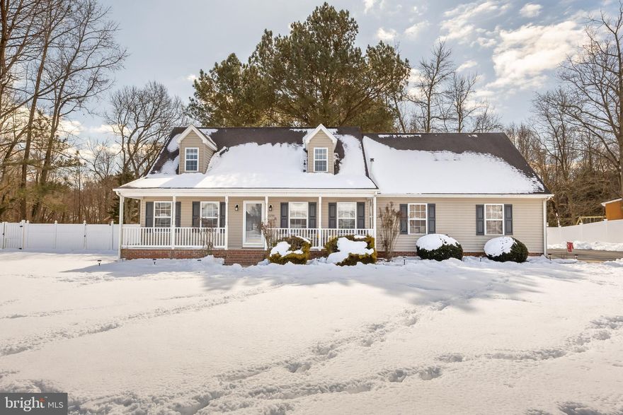 This well maintained home features a first floor primary bedroom, an over sized bonus room, and a spacious lot backing to the Historic Grist Mill (located on nearly 3 acres)! The long driveway leads you to your inviting front porch - perfect for enjoying your morning coffee! Inside you will find a spacious living room instantly made cozy by the extra heat from the pellet stove. Which opens to your kitchen & dining, separate laundry room, half bath, and attached garage. The primary bedroom with a walk in closet - leaving no arguments over where your clothes will go - and a private bath completes the first floor. Upstairs you will find your two  oversized bedrooms, full bath, and a bonus space perfect for a home office, playroom, den, or storage space. Out back you will enjoy spring & summer nights on your large back deck in your fenced back yard! Additionally you have two sheds - one for storage and one for your home gym, office, or craft space! Located in highly desirable Mardela Springs - make your showing appointment today!