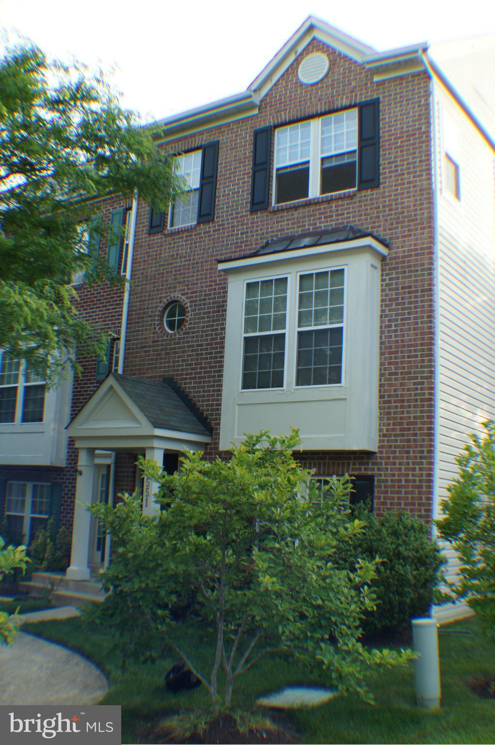 End unit townhome with 2-car garage, wood floors and special touches throughout . Fourth level loft area with separate a/c. Upgrades include, newer stove, countertops and fresh paint in some areas, newer master shower, efficient water heater. Spacious rooms make this one of the largest models in the community. Carpet updated on main level and stairs. Home shows well, schedule your showing today.
