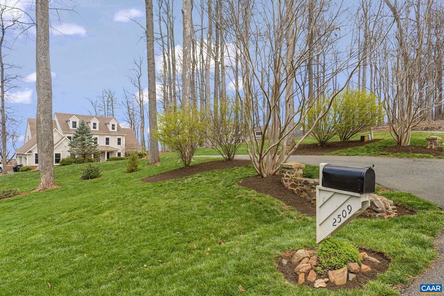 OUTSTANIND VIEWS, IN-LAW APARTMENT AND THREE CAR GARAGE makes this property an exceptional home in the sought after neighborhood of Ashcroft. Minutes from downtown, Sentara & UVA Hospital. Enjoy one floor living with a first floor primary suite, dedicated office, light-filled family room with bookcase framed fireplace & large dining room for entertaining friends & family. Spaciousness abounds with an additional primary suite on the 2nd floor along with 3 generous sized bedrooms. The third floor reveals a large family room, kitchenette, & full bath and views, views, views.  Charming 'cottage style' in-law apartment on the terrace level has a private entrance, kitchen, large custom designed walk-in closet, full bath, spacious bedroom, patio, & family room with stone fireplace. A second laundry area and exercise room completes the terrace level. Maintained and landscaped yard compliments the mountain view framed lot. A true family home with decks, porches & parking for guests. A prime property to move right in or customize to your style.,Wood Cabinets,Fireplace in Basement,Fireplace in Family Room