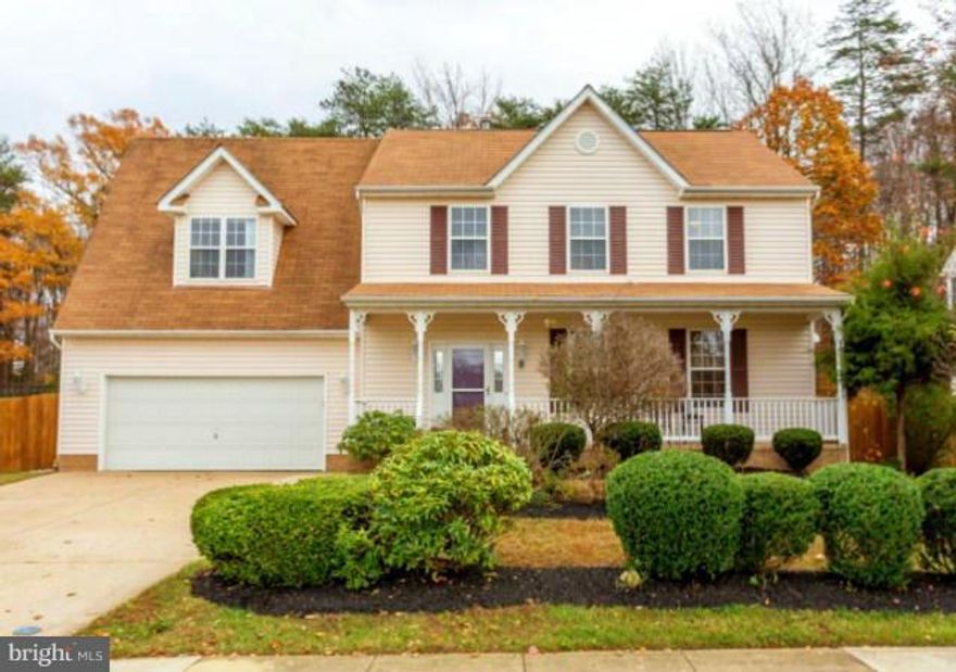 Move in ready 5 bedroom Colonial just in time for the Holidays! Light, bright home w/covered front porch & fenced rear yard! Updated fixtures & paint! Hrdwd flrs in foyer! Kitchen w/Silestone counters,glass tile back splash,desk area! DR w/ceramic tile flrs & bayed windows! LR w/gas fpl! Mstr Suite w/sitting area & Lux bath w/updated flring! L/L w/5th bdrm, Rec Rm, storage, full bath! Large Deck!