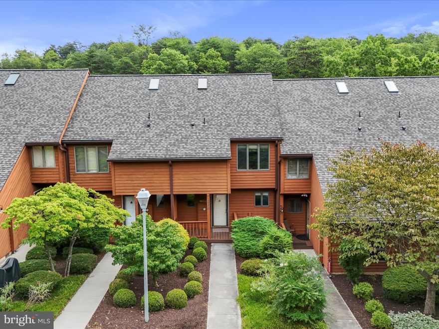 Well maintained three level town home located on the 18th fairway of the Stony Lick Mid-length Golf Course with views of the tee box & green.  Within walking distance to the Pro-shop, Clubhouse Grille, outdoor pool, putting green and sand bunker practice area. Covered entry with full glass storm door. Open decks off of the living room & owners bedroom with great views of the golf course.  Exterior storage closets off of the deck from the living room and off of the concrete patio in the lower level.  Gas logs in the fireplace with brick surround & wood mantle in living room.  Skylight in stairwell to upper level which brings in lots of natural lighting. Conveniently located on the upper level is the full size washer & dryer, close to the bedrooms.  Primary bedroom upstairs features vaulted ceilings, ceiling fan, two closets (one is walk-in) & sliding glass door that leads to a private open deck.  Skylight over the whirlpool tub & separate shower stall with glass doors in owners bath.  Guest bedroom has attached full bath with large walk in closet.  Lower level features family room, “Geo Warm” wall gas heater, storage room, full bath & sliding glass door that leads to a concrete patio with views of the golf course.  Class A membership available with $3150 initiation fee additional.  Some furniture will convey.