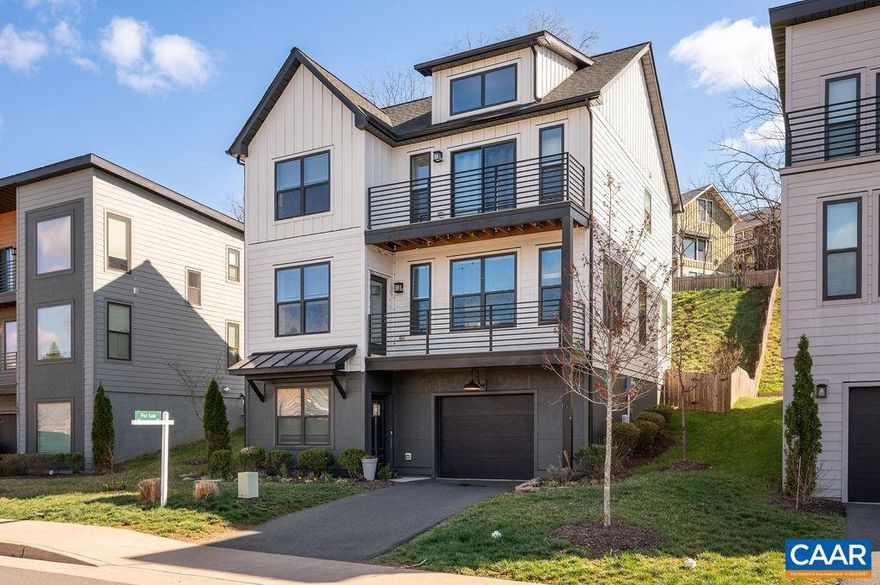 Built in 2020 by a reputable local builder, this energy-efficient home blends modern design with exceptional convenience. The entry level offers a private en suite bedroom and full bath?ideal for guests or a home office?plus direct garage access. The main level features an open-concept living, kitchen, and dining area filled with southern light, hardwood floors, and recessed lighting. The kitchen anchors the space with a large granite island, stainless appliances, abundant cabinetry, and a pantry. Sliding doors open to a rear deck with Trex decking, while a sunny front balcony offers the perfect spot for morning coffee. The top floor includes three additional bedrooms and laundry. The spacious primary suite boasts vaulted ceilings, beautiful southern exposure, and a private balcony with elevated views toward Carter Mountain?an ideal place to take in evening sunsets. The en suite bath features double vanities, a walk-in shower, and a generous walk-in closet. Convenient to I-64, downtown, restaurants, parks, and the Rivanna Trail.,Granite Counter,Maple Cabinets