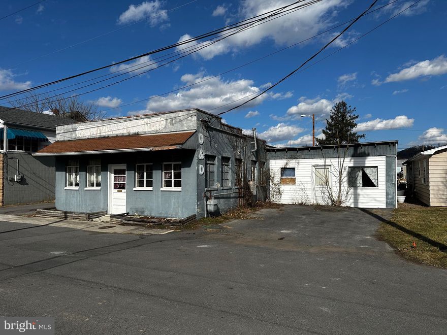 100% CONCRETE BUILDING WITH METAL ROOF. INTERIOR INCLUDES: 10’ CEILINGS, TEX WALLS, POURED CONCRETE FLOORS, STEEL I-BEAM SUPPORT, ½ BATH, SHOWROOM, WORKSHOP, OFFICE, (2) STORAGE ROOMS, 21’ X 20’ ADDITION.  SIDE AND REAR ACCESS DOORS, 2-CAR PAVED PARKING, PARKING IN REAR.  OTHER AMENITIES:  OVERHEAD GAS HEAT, HOT WATER BOILER, 100 AMP SERV. BOX, DRY CLEANING EQUIPMENT INCLUDED, W/D HOOK UP & CONVENIENT LOCATION.