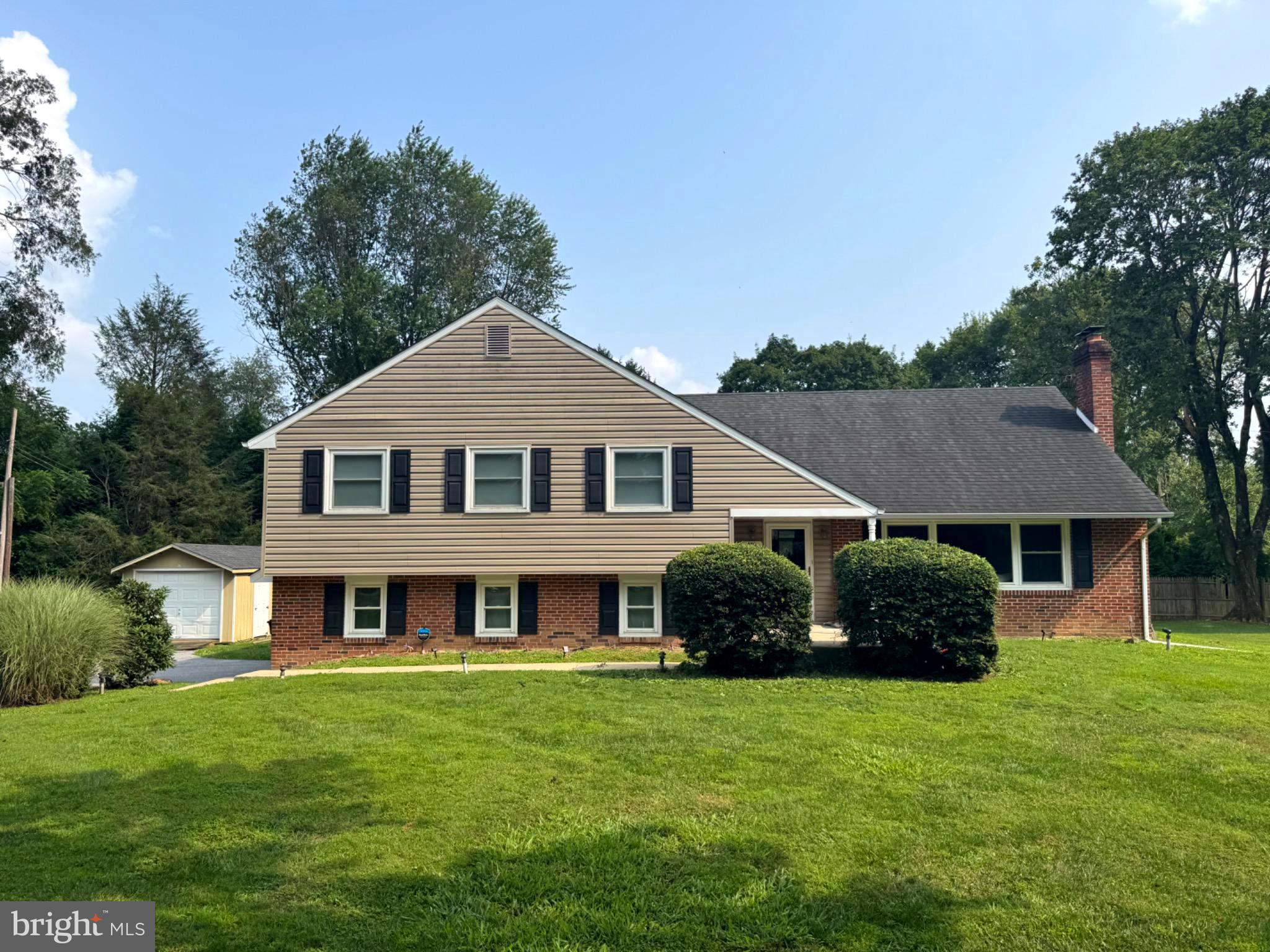 Nestled in the charming Westtown Hillside community, this delightful split-level home offers a perfect blend of comfort and functionality. With 5 spacious bedrooms and 3 full bathrooms, it's designed for both relaxation and entertaining. The heart of the home features a country kitchen equipped with stainless steel appliances, including a built-in microwave and gas range, complemented by a cozy pantry. Enjoy gatherings in the formal dining room or unwind in the inviting living area, complete with a warm fireplace. The expansive 1-acre lot provides ample outdoor space, while the full basement offers endless possibilities. The community boasts excellent schools, nearby parks, and convenient public services, making it an ideal place to call home. With an attached garage and additional driveway parking, convenience is at your fingertips. Experience the warmth and charm of this well-maintained residence, where every detail invites you to create lasting memories.