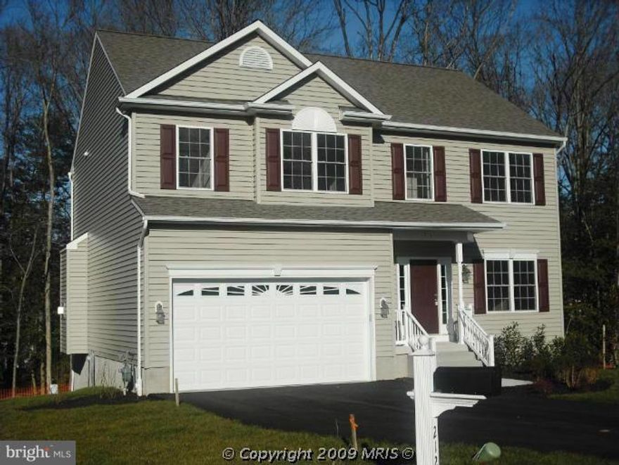 Hardwood floors, ceramic tile and all the bells and whistles of new construction.  In a small neighborhood of like homes but this one has no HOA!!! Walk in closets in all bedrooms. Laundry on bedroom level. Kitchen and dining area open to family room with FP and sliders to deck. Large side yard with sitting area and fire pit.