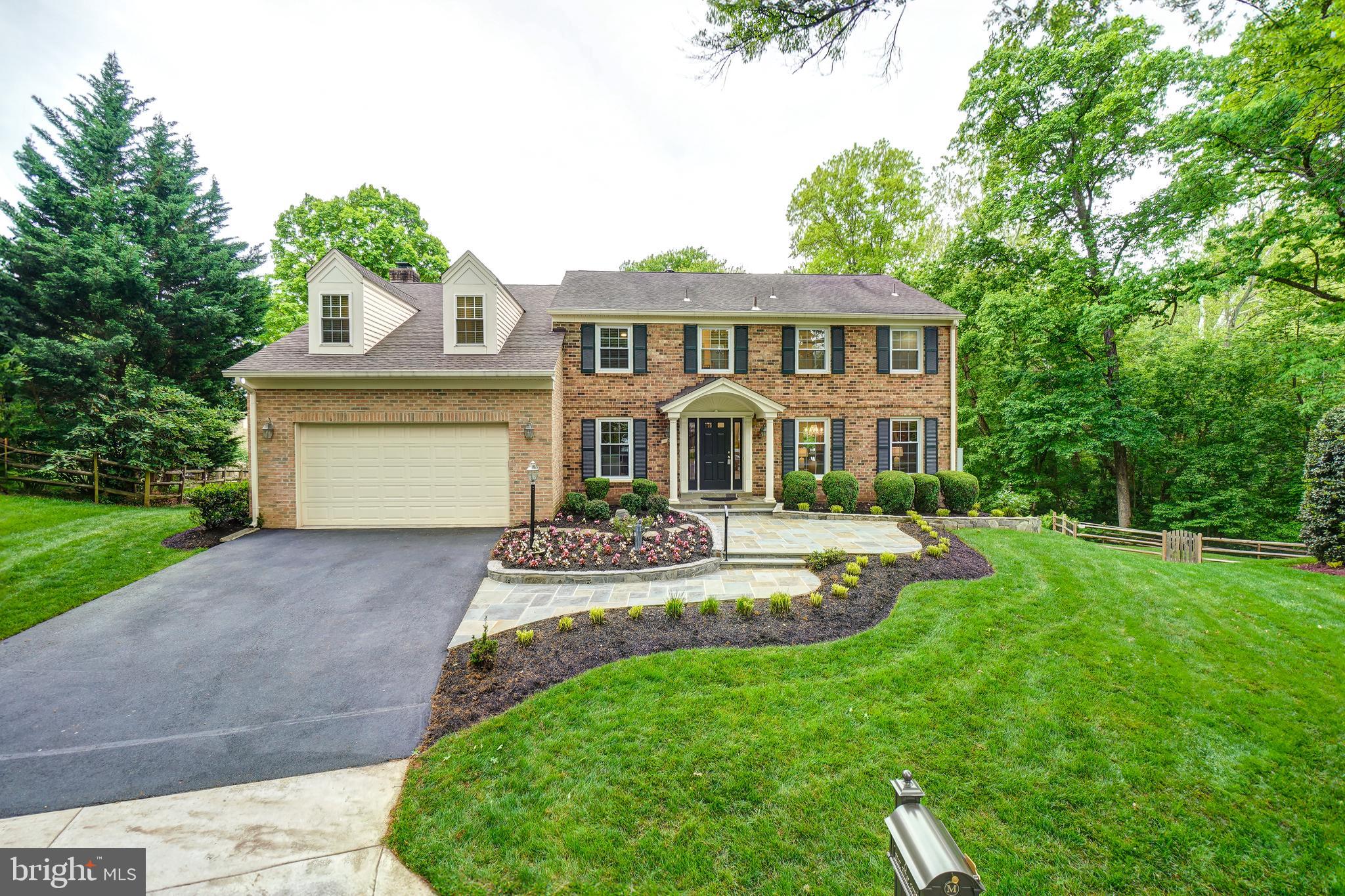 Offers will be reviewed at 4pm on Monday May 13. Step into this beautifully expanded and meticulously renovated colonial home in the highly sought after Fallsmead neighborhood, where classic charm meets contemporary style. Originally a classic staple of the neighborhood, this stately home has been transformed through two multi-level additions totalling 1,500+ SQFT of additional areas, offering a grand total of 5 substantial bedrooms, 3 full and 2 half baths, the space could not be more ideal. The heart of the home is the newly renovated kitchen, where cooking and socializing blend seamlessly. Equipped with brand-new shaker cabinets, sleek quartz countertops, and high-end stainless steel appliances, it’s a chef and entertainer’s dream. The expanded kitchen now includes a morning room, with its floor to ceiling windows and vaulted ceiling provides a seating area that accommodates 12-16 guests comfortably, making it perfect for all occasions. The spacious living and dining rooms are cleverly designed to create multiple seating and conversation areas. Relax and recharge in the nearly 700 SQFT family room that features a wall of 4 large windows and provides multiple sitting areas .. one is an ample space for cozying up to the wood burning fireplace with your favorite beverage or, when the mood strikes, one where you can lounge in front of your large screen TV, making it an ideal spot for hosting game days or binge-watching sessions in style. Don’t miss the large deck with its multiple access points overlooking the serene woodlands which backs to the property. The newest of the dual owner’s suites provides a luxurious, retreat accessed by a private, second staircase. The suite is complete with a 100 SQFT walk-in closet, cozy lounge area and features a spa-like en-suite bathroom with sunken tub and a separate glass enclosed shower as well as dual vanities. The original owner’s suite offers generous space with 2 closets large enough for multi-season wardrobes, a private dressing area and freshly renovated full bathroom. The additional 3 large bedrooms and bathroom complete the upper level. The lower level has been thoughtfully finished with a large recreation room that provides seemingly unlimited options for gaming tables, large screen TVs, or a little of both, and an updated powder room. There is also a large additiona room with versatile space that can serve as a private office or gym. The final touch to this masterpiece is the heated and air conditioned 250+ sqft secure storage area under the family room. The home sits on a private lot offering an oasis-like feel. It is located just minutes away from top-tier shopping, dining, and is located in one of the highest-rated school clusters (Wootton HS, Frost MS, Fallsmead ES) in the county. Commuter routes are readily accessible, making this home as convenient as it is beautiful. This property is not just a house, but a versatile home ready to cater to all aspects of modern, luxurious living.