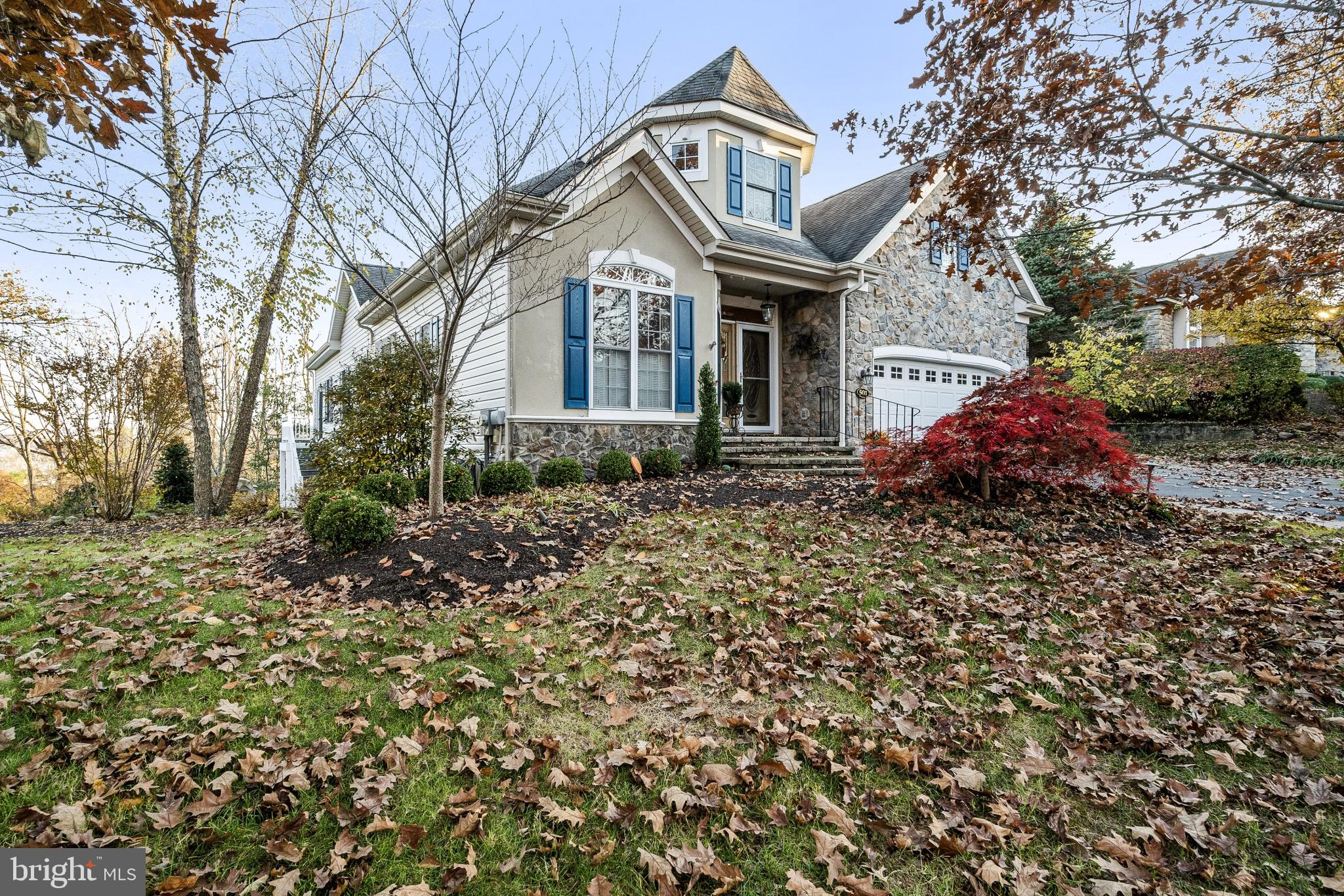 Gorgeous corner carriage style home in Fox Run Preserve with multiple living levels! Beautiful views from every window! First floor master suite, open floor plan! Enter through a beautiful custom beveled glass door into a custom hardwood foyer just off of the sunlit living room (currently used as a dining room);  the upgraded kitchen features granite countertops and heated ceramic tile flooring, greenhouse window over the double sinks, gas cooking, convenient breakfast bar overlooking the dining area and family room which feature custom accent trimmed hardwood flooring, skylight, vaulted and cathedral ceilings, a stained glass window accent feature and a fireplace; a sunroom is just off of the family room and features custom designed and heated ceramic tile flooring, skylight, door to side landing and stairs to side yard; the main bedroom suite is off of the family room and features a walk in closet, tray ceiling with dentil molding, and main bath with stall shower and soaking tub; also on the first level are a half bath, laundry room and an additional bedroom or office; the second level opens to a large loft that overlooks the dining area and family room with a large storage closet; two large bedrooms and a full hall bathroom with tub/shower are also on this level along with storage in the eaves; the lower level offers an incredible entertaining area with walkout to a paver patio with paver walls; it also includes a half bath, closet storage, a workshop with separate entrance door; custom full wall cabinet; utility room and plenty of storage area; other amenities included are a 2 car garage, 9' ceilings, gas heating, central air, .... Convenient to the Historic town of New Hope, as well as  Princeton, Philadelphia and New York