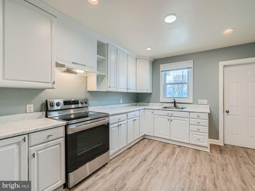 Located in the vibrant neighborhood of Patterson Park.  2926 E. Fayette Street has a charming interior rowhome that blends modern amenities with traditional aesthetics. This home features an open layout over multiple levels, offering both comfort and functionality.

As you enter, the main level welcomes you with an open floor plan, perfect for both relaxing and entertaining. Original hardwood floors add warmth and character, complemented by the contemporary touch of tray ceilings and designer light fixtures, which create an inviting and stylish ambiance.

The kitchen, a highlight of the main level, is spacious and well-equipped. It boasts stainless steel appliances, providing both efficiency and elegance, making it ideal for those who enjoy cooking and hosting.

The upper level of the home features two cozy bedrooms and a versatile den, which can serve as an office, study, or additional sleeping area. This level also has a full bath.

Adding to the living space, the lower level of this home reveals a third bedroom, offering privacy and tranquility. This level also includes another full bath, enhancing the home's functionality and appeal.

Outside, the property features a fully fenced rear yard, a sanctuary for outdoor relaxation or intimate gatherings. This exterior space adds to the charm and utility of the home, making it a complete package for a variety of lifestyles.

Overall, 2926 E. Fayette Street is a beautifully crafted home that offers a blend of traditional charm and modern living, nestled in the heart of Baltimore City.