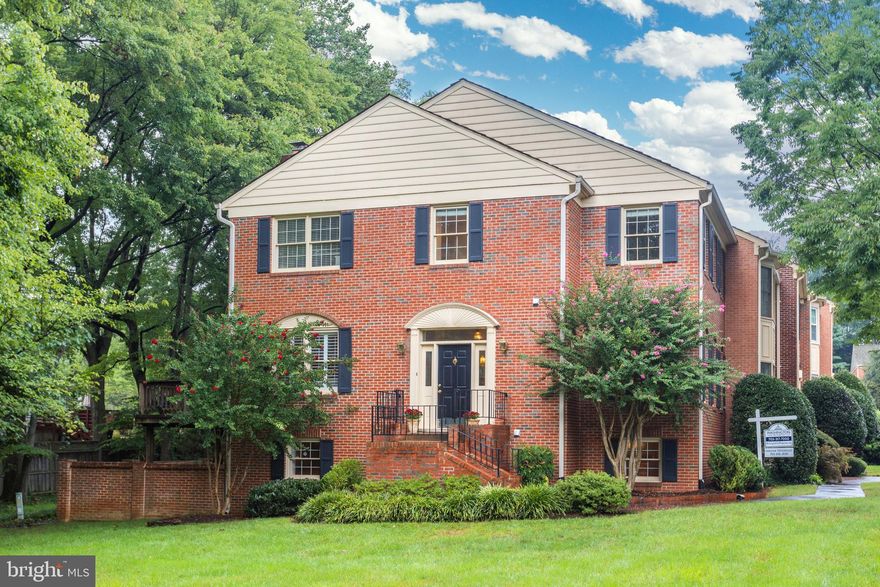 CONTRACTS DUE AT 2 PM MONDAY 9/14.  This beautiful end unit all brick townhouse is located in a enclave of 22 town homes on seven acres with a pond just a ten minute walk to the West Falls Church Metro.  The kitchen and all baths have been recently updated!  Pride in ownership shows throughout this lovely home.  Hardwoods throughout the main level.  The newer kitchen features granite counter tops, white cabinetry including a built-in curio cabinet and stainless steel appliances.  A cozy family room with gas fireplace adjoins the kitchen.  New Andersen sliding glass door opens to a deck with gas hookup for the grill. The master bedroom has a cathedral ceiling and includes two closets (one walk-in), a dressing area with a separate sink with granite and white cabinets, and luxury master bath with separate tub and shower.  There are two more upper level bedrooms that share a hall bath that has been updated with white cabinets, granite counters and ceramic tile.  The walkout lower level includes a recreation room with a gas fireplace and a wall of built-ins and has outdoor access via a new storm door to a slate patio.  Completing this level are a bedroom and full bath, laundry room and workbench area.  A great location just minutes to downtown Falls Church City, Tysons, I-66 and 495.