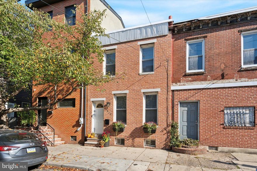 Welcome to 1635 Catharine St, a charming and updated 2-bedroom, 1-bath home in the heart of Graduate Hospital, offering an easy walk to Rittenhouse Square. The classic red brick façade with lush planters adds curb appeal, while inside, high ceilings, hardwood floors, and oversized windows create a bright and inviting atmosphere. The open living and dining areas easily accommodate gatherings, and the stylish kitchen boasts granite countertops, stainless steel appliances, and a subway tile backsplash. A private patio extends the living space outdoors, perfect for dining, gardening, or relaxing. Upstairs, the sunlit primary bedroom features modern flooring, two closets with built-in organization, and ample natural light, while a second bedroom and a beautifully designed bathroom with brass-tone fixtures and a soaking tub complete the level. The lower level provides great storage and laundry space, adding to the home’s practicality. With a Walk Score of 98, you’re steps from South Street’s vibrant shops and restaurants, as well as Rittenhouse Square’s renowned dining, shopping, and entertainment. Nearby essentials include Target, Sprouts Farmers Market, and Wine & Spirits, plus the Schuylkill River Trail for outdoor recreation. Commuters will appreciate the easy access to public transit, Center City, University of Penn, Washington Ave, Broad St, and I-76. Schedule your tour today! Property being sold as-is.