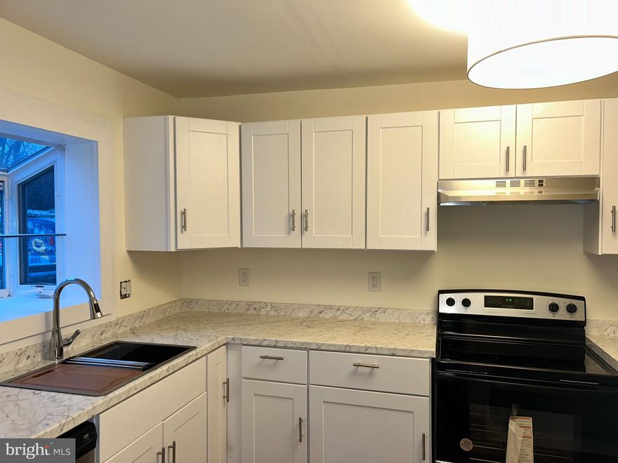 Welcome home to 410 Charles St, a 4 bedroom 1.5 bathroom home located on a quiet street close to all of the amenities of downtown Hurlock. This home boasts a gorgeous new kitchen, fresh paint throughout, luxury vinyl plank floors in the kitchen and bathrooms, new carpets in all of the bedrooms and new mini-split systems throughout! In the kitchen, you'll notice new cabinets, a luxurious deep stainless steel sink with custom cutting board accessory, new stainless steel stove, and new counter tops that provide ample space for food prep! Upon entering the front door, you're greeted with natural hard wood floors throughout the spacious living room and dinning room and large windows allowing for gorgeous natural light to fill the rooms. Also on the main floor is the laundry room/mud room, a half bath and a massive primary suite that is equipped with a walk-in closet! Upstairs are three additional bedrooms and a full bathroom with tub/shower. With a large backyard, the possibilities are endless! Move-in ready and waiting for it's new owners to make it their own.