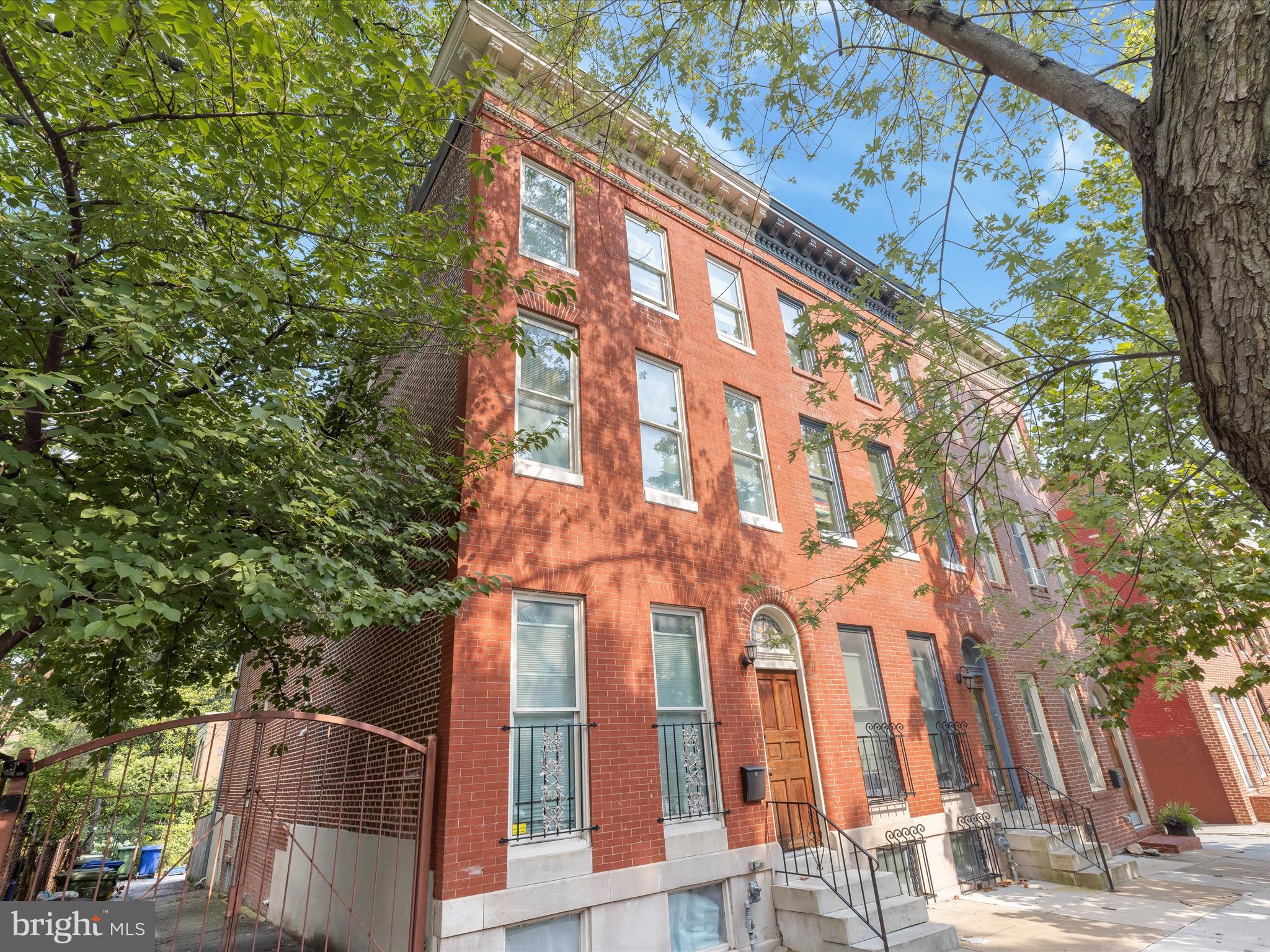Distinctive End-Unit Rowhome Just Steps from Union Square Park in Historic SoWeBo. Originally built in 1860, this spacious home offers over 2,300 square feet of character-rich living space thoughtfully updated for modern living. A full renovation in 2019, along with subsequent enhancements, seamlessly blends historic charm with contemporary convenience.
From the moment you enter through the tiled vestibule, the home’s craftsmanship is on full display. The front parlor, filled with natural light, features original French doors with beveled glass crowned by an intricate fretwork transom—an eye-catching example of 19th-century design. Pressed tin ceilings, tall windows, and warm hardwood flooring enhance the sense of elegance, while finely detailed millwork offers a nod to the past. This versatile space easily functions as a music room, home office, or formal sitting area.
Throughout the home, you'll find inlaid hardwood floors, period architectural accents, and updated systems. The well-appointed kitchen boasts granite countertops, stainless steel appliances, and ample cabinetry. Located just minutes from the MARC Train and within walking distance to the MTA, University of Maryland BioPark, UMB campus, and Shock Trauma. Convenient to neighborhood shopping and major commuter routes, including I-95 with access to DC, Columbia, Ft. Meade, and Annapolis.