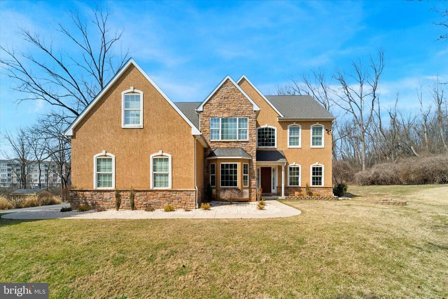Tucked away down a long private driveway, this stunning home offers the perfect blend of privacy and convenience on nearly ¾ of an acre! A mix of open yard and wooded surroundings creates a peaceful retreat, yet you're just minutes from major highways, the Turnpike, Plymouth Meeting Mall, Whole Foods, and Conshohocken. The driveway leads to a three-car attached garage. Step inside to a bright and inviting foyer that welcomes you into a thoughtfully designed layout. To the right, the formal living room flows effortlessly into the formal dining room—setting the perfect stage for memorable gatherings. To the left, french doors open to a private home office with peaceful front-yard views. The heart of the home is the expansive kitchen, featuring tall cabinetry, granite countertops, a long center island and a built-in dining nook. Open to the family room with a high vaulted ceiling, this space is designed for both everyday living and entertaining. Gather around the striking stone fireplace or step through the sliding doors to the paver patio—perfect for outdoor dining and relaxing while overlooking the serene backyard. A butler’s pantry with a wine cellar adds extra functionality, while the first-floor laundry room off the garage enhances daily convenience. A convenient powder room completes the main floor. Upstairs, the primary suite is a luxurious retreat with a generous sitting area, an impressive 20-foot walk-in closet, and a newly renovated en-suite bathroom. Designed for ultimate comfort, the primary bathroom features a dual vanity with ample under-cabinet storage, a separate soaking tub, and a glass-enclosed stall shower. Three additional spacious bedrooms offer plenty of closet space and share access to a full hallway bathroom with dual vanity as well. The fully finished lower level provides a versatile space, featuring a second family room, a recreation area, and a private bedroom with its own full bathroom—perfect for guests, a home gym, or any setup that suits your lifestyle!  Beyond the home, the community offers an exceptional lifestyle with award-winning Colonial School District, parks, and local dining. Whether you're exploring nearby nature trails, enjoying local shopping, or commuting with ease, this location truly has it all. With its blend of privacy, modern comforts, and unbeatable location, this home is a must-see. Schedule your showing today!