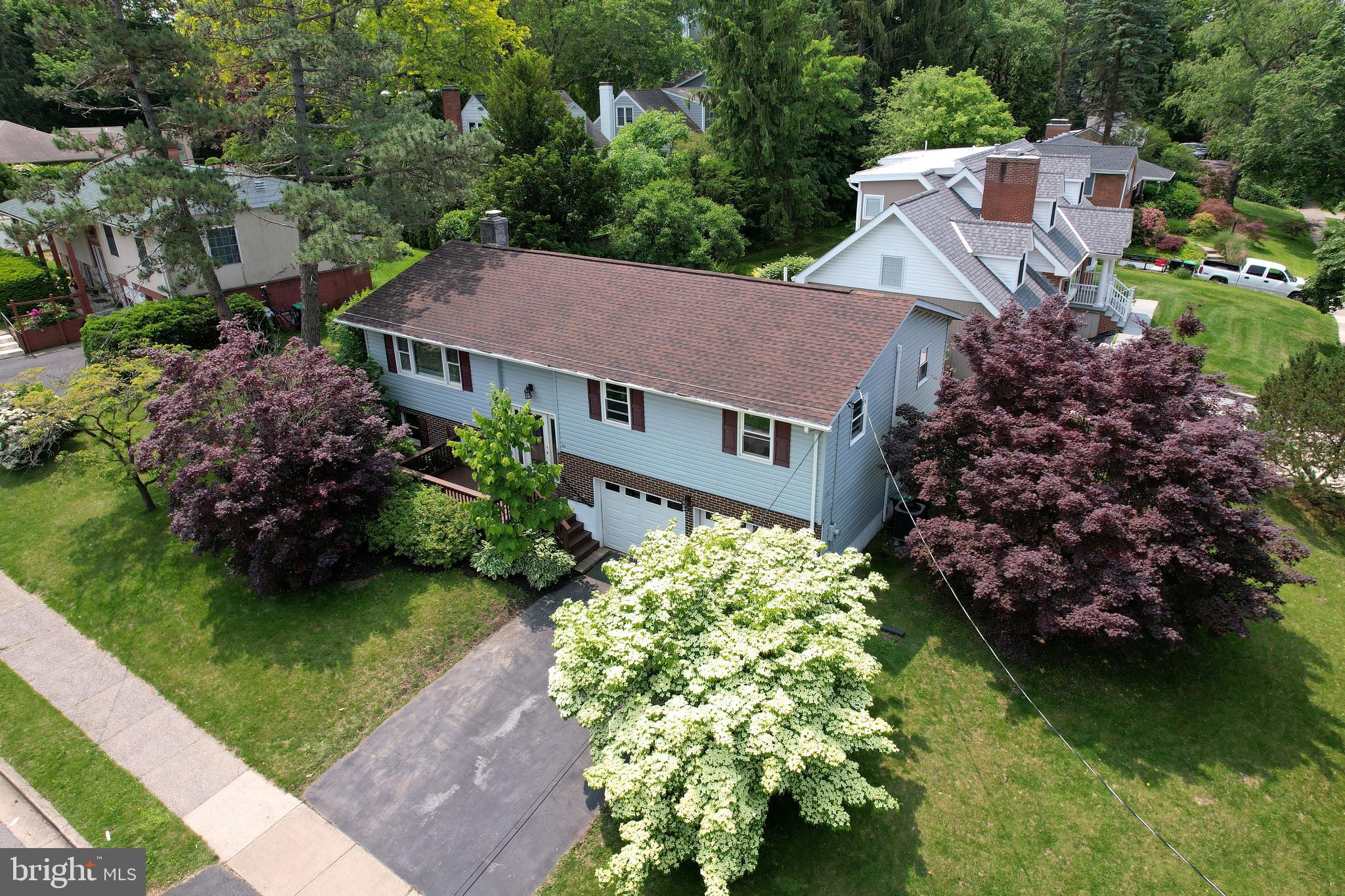 Located just blocks from Penn State University, Downtown State College, and Corl Street Elementary, this charming home in the State College Borough offers an unbeatable combination of convenience and comfort. The bright and spacious living room flows into the dining area, which opens to a large deck and fenced-in backyard—perfect for entertaining or relaxing. The eat-in kitchen features hardwood floors and ample cabinet space. Upstairs, you'll find three generously sized bedrooms and two full baths, all with fresh paint and new carpet for a clean, move-in-ready feel. The lower level offers a cozy rec room with a wood-burning fireplace, a flexible bonus room ideal for an office or den, and a convenient half bath. Additional highlights include an oversized two-car garage and an efficient heat pump with central heating and air conditioning. This is a rare opportunity in one of State College’s most sought-after locations!