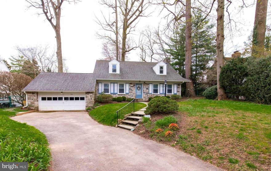 Charming Center Hall Stone Home in the desirable Wynnewood Estates Neighborhood in the Award Winning Lower Merion School District.  Only a 20-25 minute commute to Center City or King of Prussia.  Walking distance to Ardmore, Suburban Square, Trader Joe's, Whole Foods, Starbucks, many restaurants, shopping, Wynnewood Train Station (R5 to Center City), South Ardmore Park (18 Acre active park with many amenities), Wynnewood Shopping Center with ACME and Giant Supermarkets.  Floor plan consists of a center hall, very large living room with fireplace, outside exit to rear patio & fenced yard, formal dining room with deep sill windows, sunny kitchen with gas stove, refrigerator, counter top eating area, outside exit to rear yard, built-in bookcase, den / office with coat closet, and powder room.  Full basement with laundry area (washer & dryer included) and utility sink.  Second level has a Master Bedroom Suite with walk-in closets and master bath, 2 additional bedrooms with ample closets, good size linen closet & hall bath.  Charming Park Like Setting with mature landscaping with long driveway that leads to an attached 2 car garage with automatic door opener.  Low maintenance stone exterior with newer roof, siding, capping & replacement windows (about 4 years ago).  Gas Hot Air Heating System and Central Air Conditioning.  Excellent Opportunity to own this well cared for home on the Main Line.